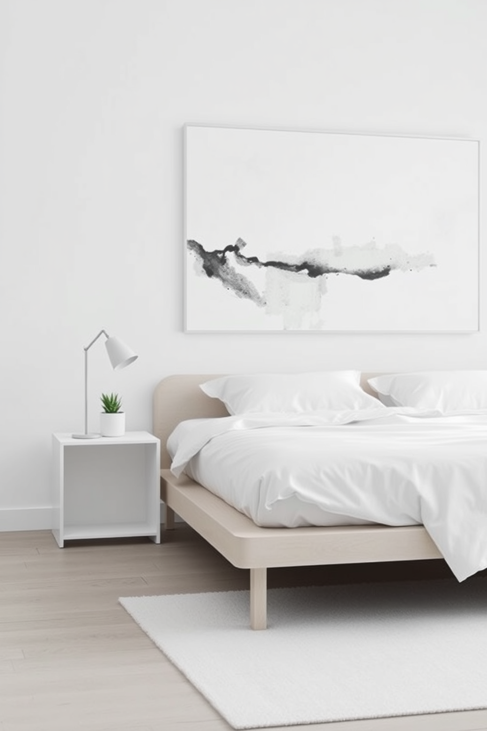 A serene bedroom space featuring a low-profile platform bed with crisp white linens and a single accent pillow. The walls are painted in a soft gray hue, and a large abstract painting in muted tones hangs above the bed. Natural light streams in through sheer curtains, illuminating a simple nightstand with a small potted plant. The floor is adorned with a plush area rug that adds warmth to the minimalist aesthetic.