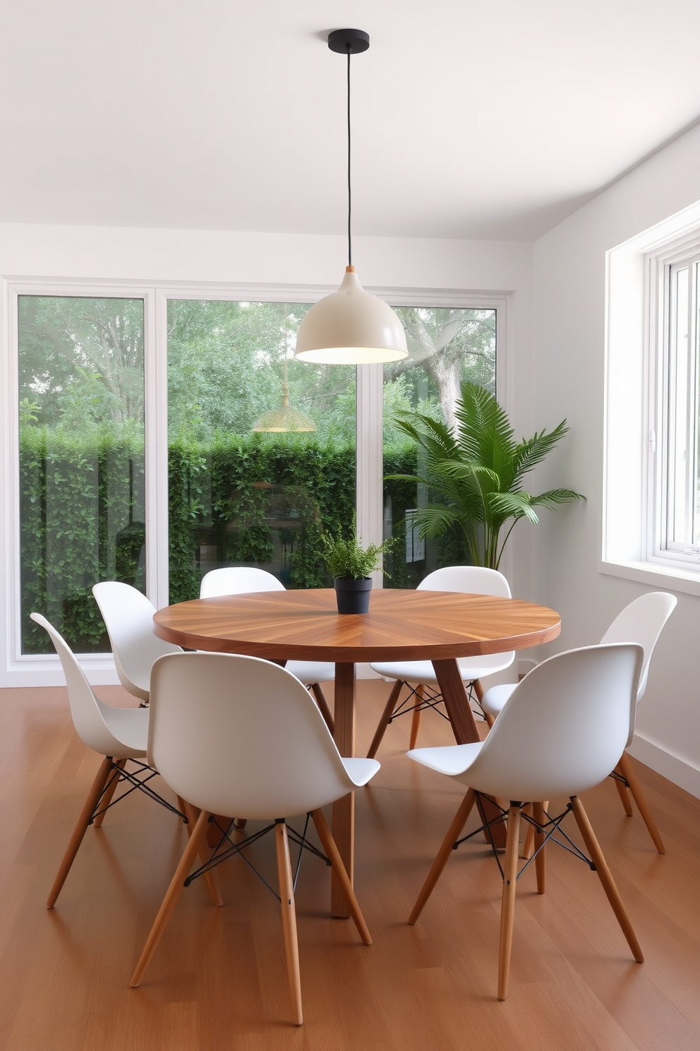 A minimalist dining room features a sleek wooden table surrounded by simple, modern chairs. The walls are painted in a soft white, and a large geometric-patterned rug anchors the space, adding visual interest without overwhelming the design. On the wall, a large piece of abstract art with geometric shapes complements the decor. Natural light floods the room through large windows, creating an inviting atmosphere perfect for both casual meals and elegant gatherings.