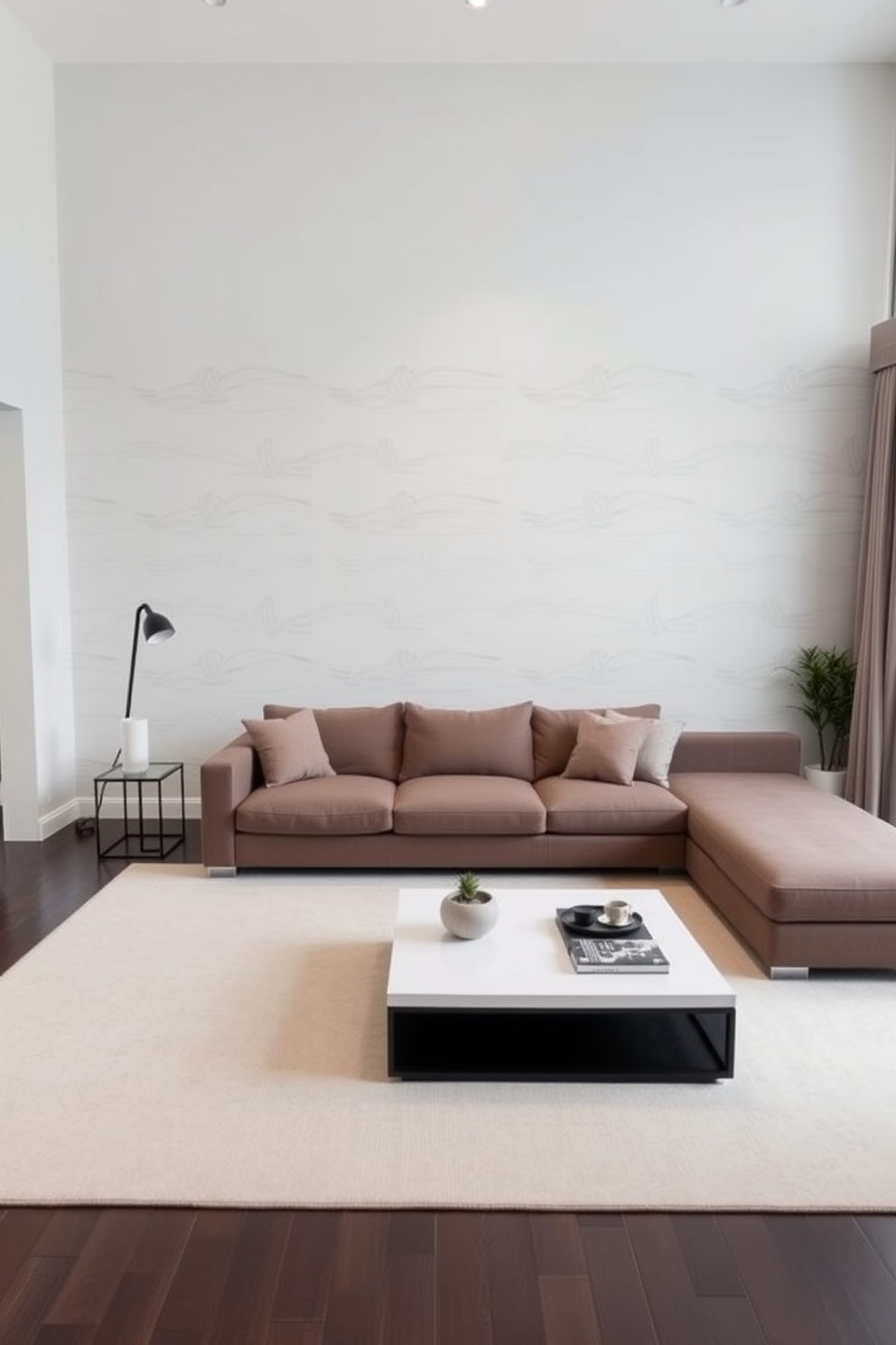 A spacious family room with a neutral color palette featuring a large sectional sofa and a sleek coffee table at the center. The walls are adorned with simple artwork, and a soft area rug anchors the seating area while maintaining a clutter-free environment. Natural light floods the room through large windows dressed with sheer curtains. A few carefully placed plants add a touch of greenery without overwhelming the serene aesthetic.