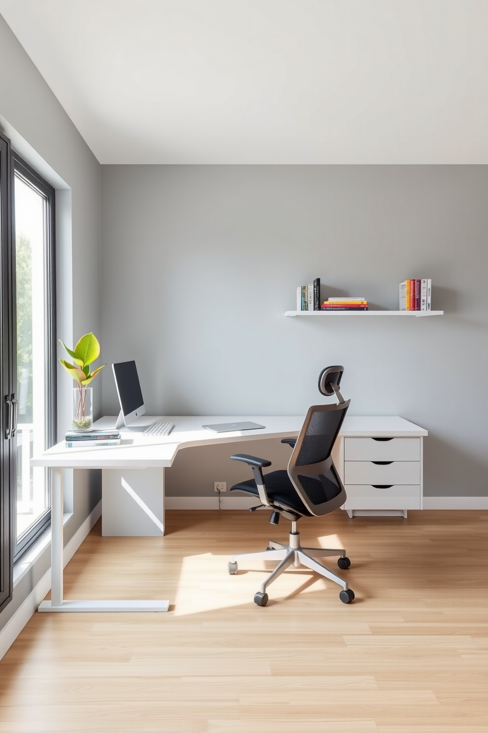 A minimalist home office featuring a sleek white desk with clean lines and a comfortable ergonomic chair. The walls are painted in a soft gray, accented by subtle pops of color through decorative items like a vibrant plant and a few colorful books on a floating shelf. Natural light floods the space through a large window, highlighting the simplicity and functionality of the design. The floor is adorned with a light wood finish, creating a warm and inviting atmosphere that promotes productivity.