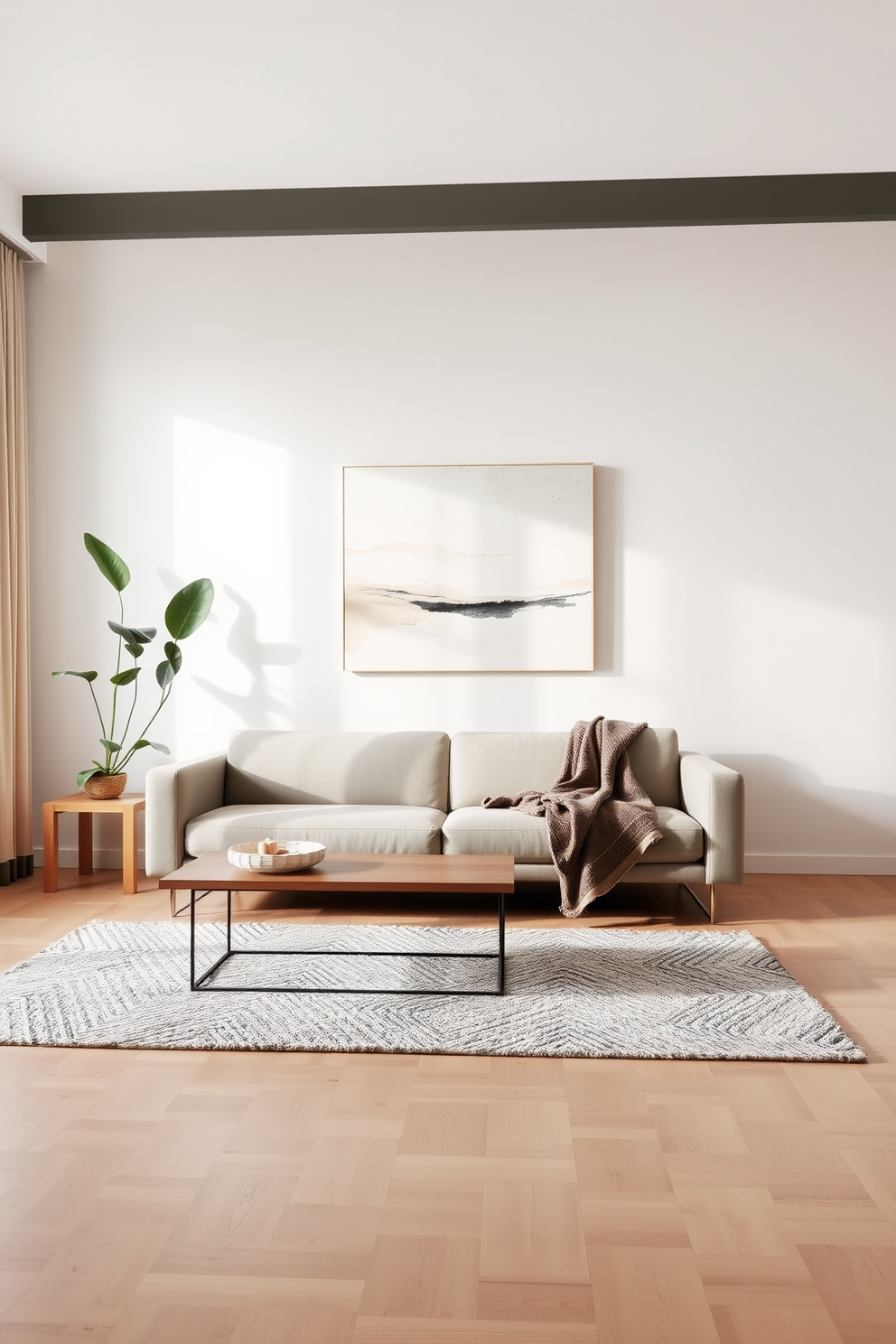 A serene minimalist living room featuring a sleek low-profile sofa in a neutral tone, complemented by a simple wooden coffee table with clean lines. The walls are painted in a soft white, allowing natural light to flood the space, while a single large abstract artwork adds a touch of elegance without overwhelming the room. In one corner, a tall indoor plant brings a hint of nature, while a cozy textured throw blanket drapes casually over the sofa. The flooring is a light hardwood, and a plush area rug in muted colors anchors the seating area, creating a warm and inviting atmosphere.