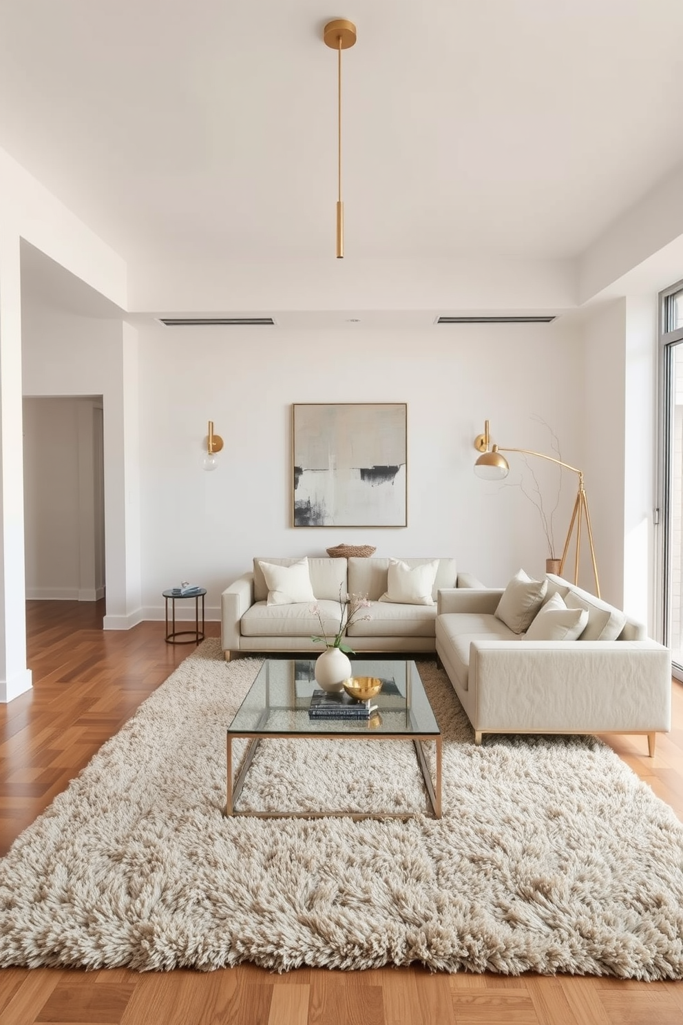 A minimalist living room with a neutral color palette featuring a sleek sofa and a glass coffee table. The room incorporates a mix of metal finishes with brass light fixtures and chrome accents on the furniture for subtle contrast. The walls are adorned with abstract art in soft tones, enhancing the serene atmosphere. A plush area rug anchors the space, while large windows allow natural light to flood the room.