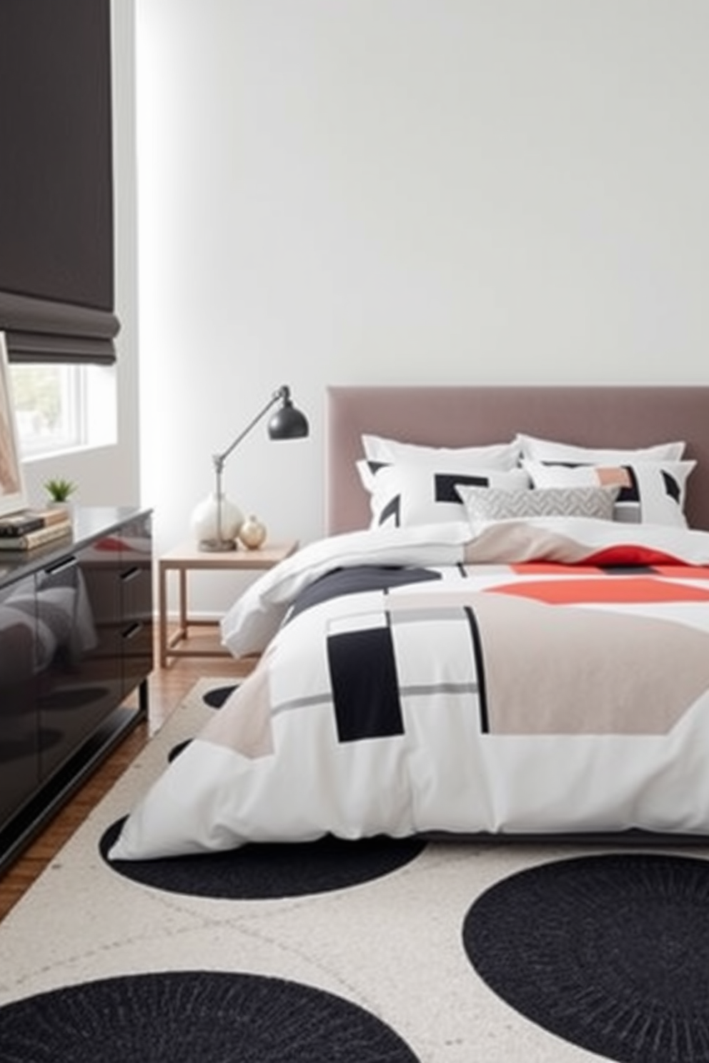 A modern bedroom featuring geometric patterns on the bedding and rugs creates a dynamic visual interest. The color palette includes soft neutrals complemented by bold accents, enhancing the contemporary feel of the space. The bed is dressed in a duvet cover adorned with large, abstract geometric shapes, while the area rug beneath showcases a contrasting pattern. Sleek furniture pieces in minimalistic designs complete the look, ensuring the room feels both stylish and inviting.