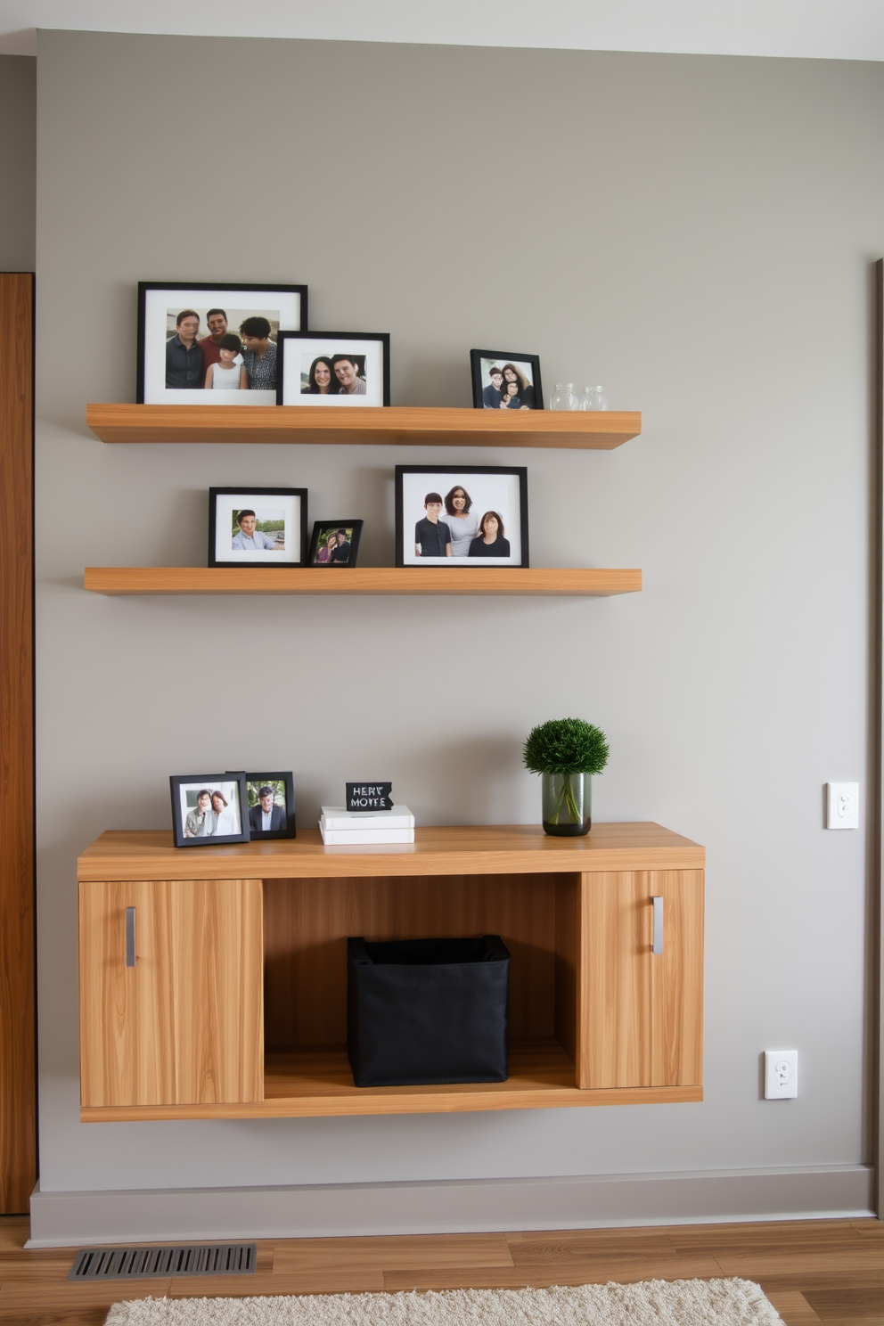 A modern entryway features sleek floating shelves adorned with framed photos of family and friends. The walls are painted in a soft gray, creating a warm and inviting atmosphere that complements the natural wood tones of the shelves.