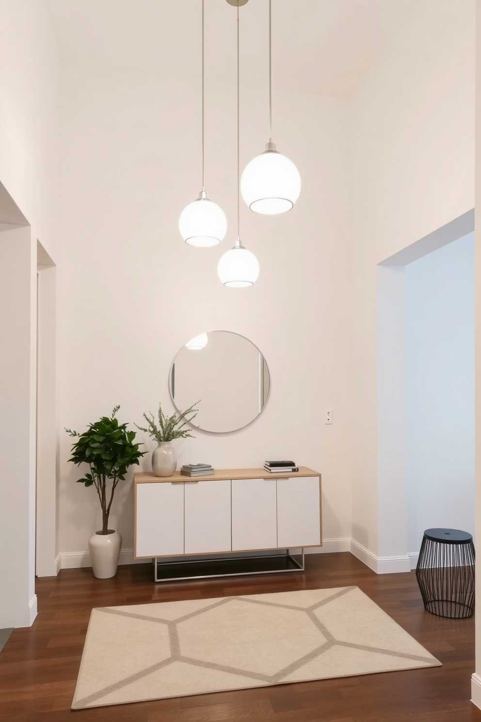 Bright pendant lights hang elegantly from the ceiling, casting a warm glow throughout the space. The entryway features a sleek console table with a minimalist design, complemented by a stylish mirror above it. The walls are painted in a soft neutral tone, creating a welcoming atmosphere. A geometric rug lies on the floor, adding texture and visual interest to the modern entryway.