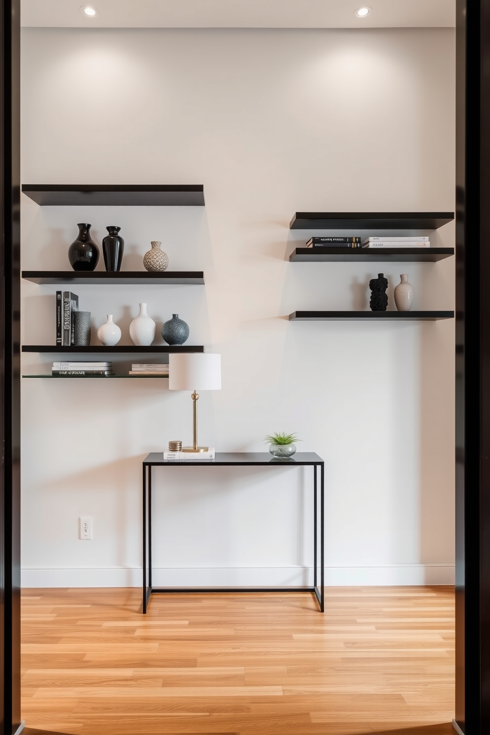 A modern foyer features sleek floating shelves mounted on the walls, showcasing an array of decorative items such as vases and books. The flooring is a polished hardwood, and a stylish console table sits beneath the shelves, adorned with a statement lamp and a small potted plant.