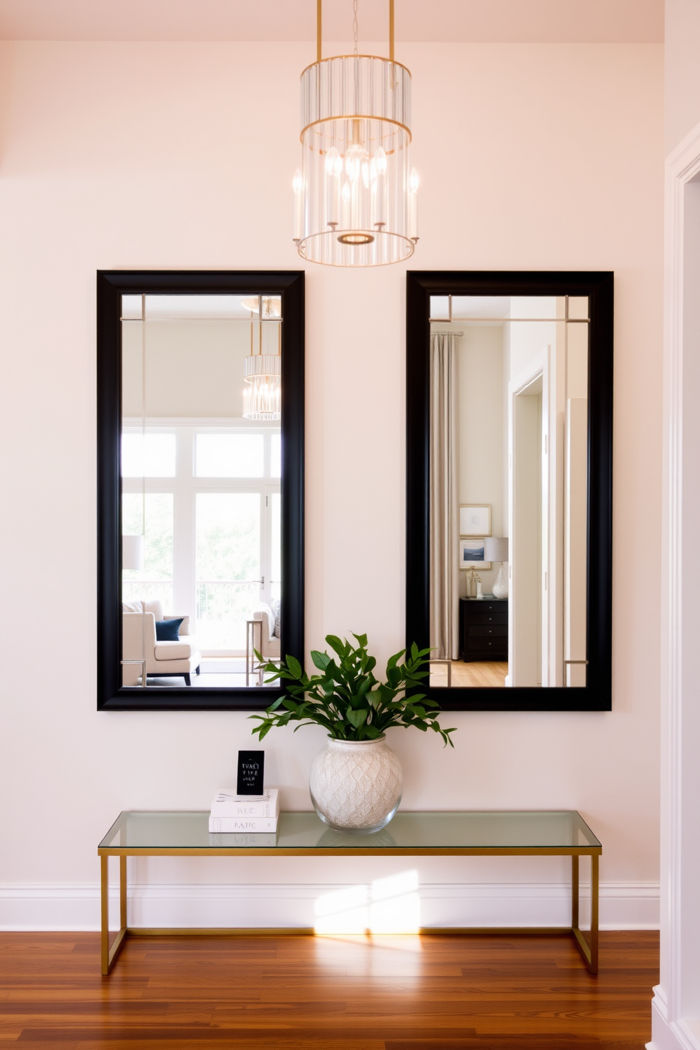 A modern foyer featuring a pair of stylish mirrors that reflect natural light and create an inviting atmosphere. The space is adorned with sleek furniture and a statement light fixture that adds a touch of elegance. The walls are painted in a soft neutral tone, complementing the warm wooden flooring. A decorative console table is placed beneath the mirrors, topped with fresh greenery and artistic decor.