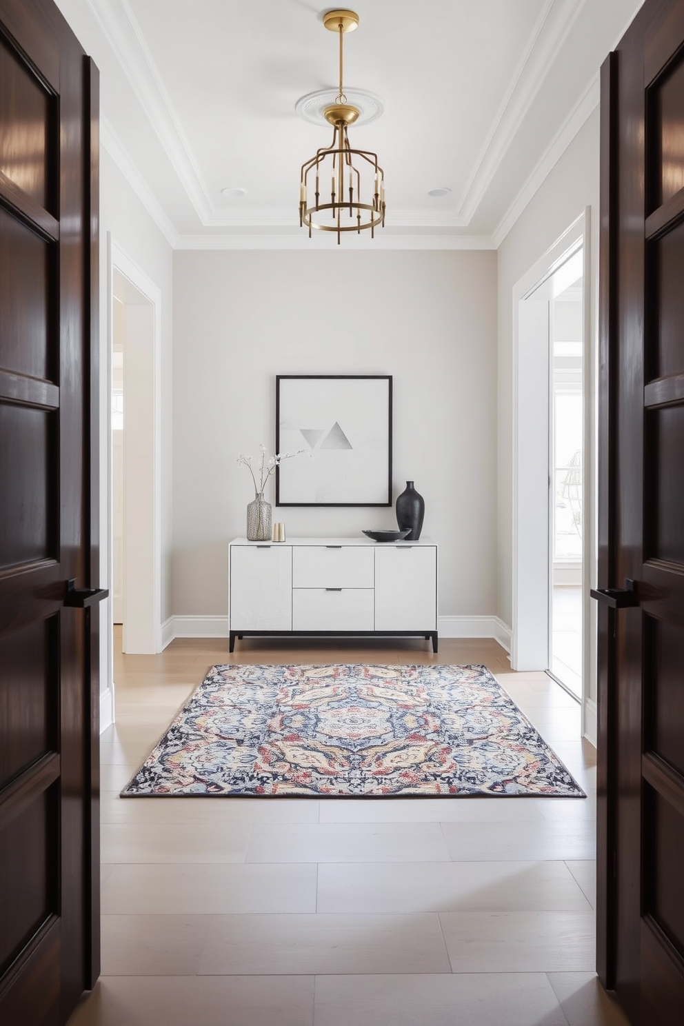 A serene foyer space featuring a neutral color palette that promotes a calming atmosphere. The walls are painted in soft beige, complemented by a light gray console table adorned with decorative items. A large round mirror hangs above the console, reflecting natural light that floods in from a nearby window. The flooring consists of warm-toned hardwood, enhancing the inviting feel of the space.