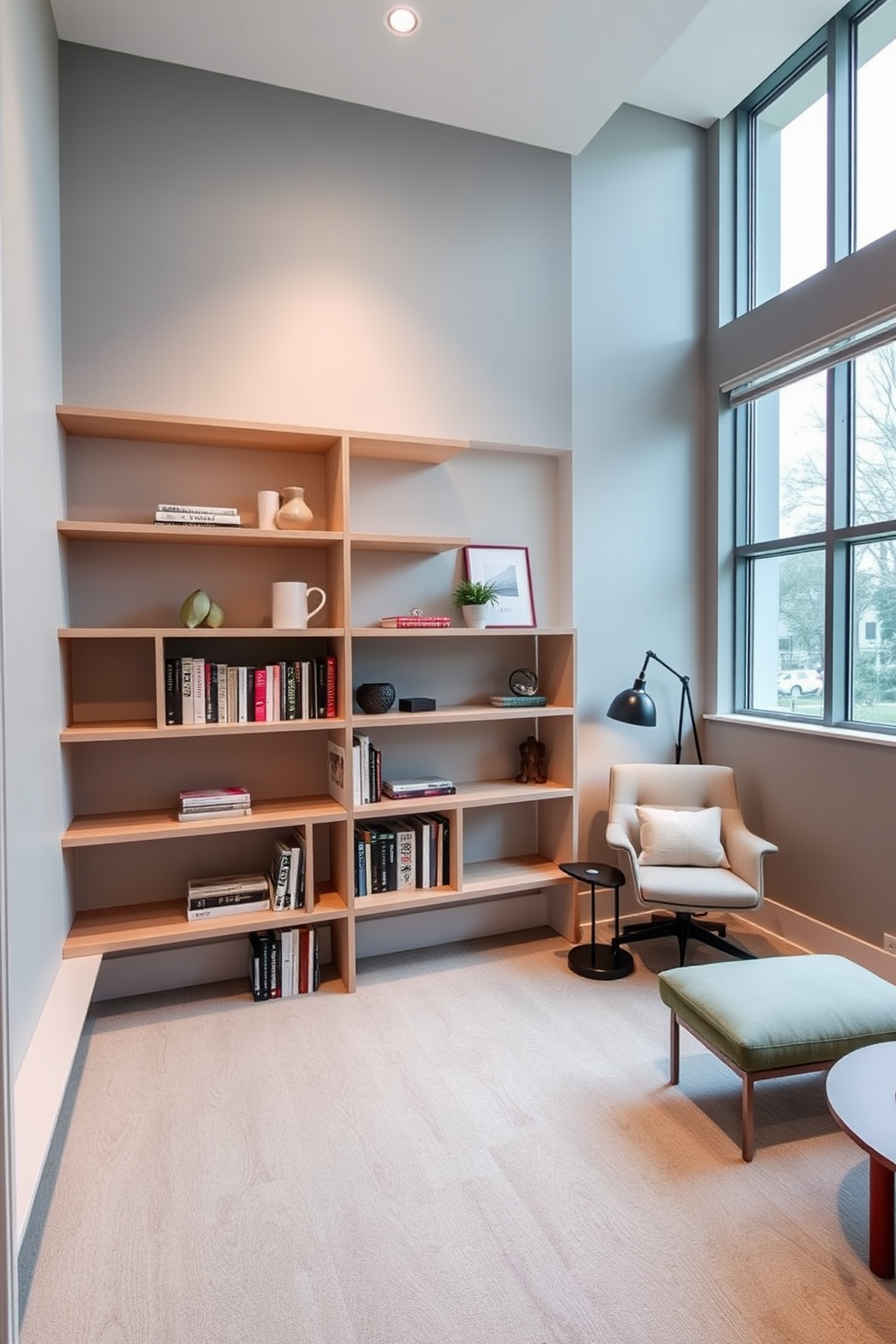 A minimalist shelving unit with sleek finishes is the focal point of the modern home library. The shelves are made of light wood and feature clean lines, showcasing a curated selection of books and decorative items against a backdrop of soft gray walls. A cozy reading nook is integrated into the design, complete with a stylish armchair and a small side table. Large windows allow natural light to flood the space, enhancing the serene atmosphere perfect for relaxation and reading.