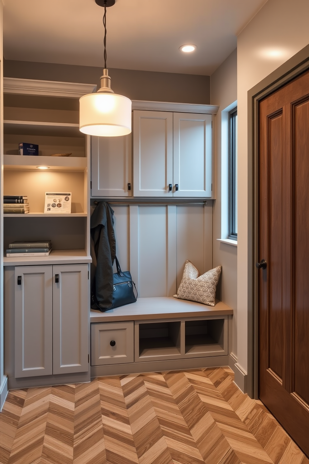 A modern mudroom features elegant built-in cabinetry that provides ample storage and a sleek appearance. The cabinetry is finished in a crisp white with brushed nickel hardware, seamlessly integrating with the surrounding decor.