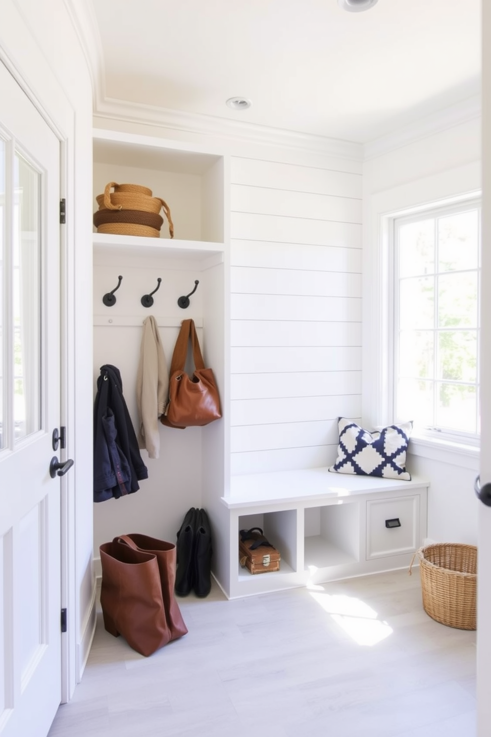 A minimalist bench is designed with sleek lines and a subtle finish, integrating hidden storage compartments beneath the seat for practical organization. The mudroom features a harmonious blend of functionality and style, accented by natural light streaming through large windows, creating an inviting atmosphere.