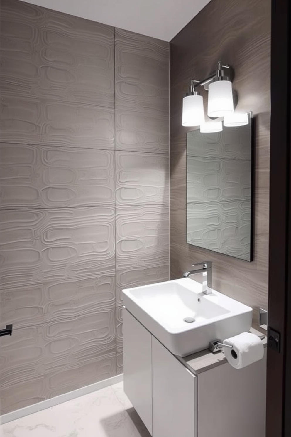 A minimalist powder room featuring sleek white walls and a floating vanity with a single, integrated sink. The space includes a large frameless mirror above the vanity and a subtle, elegant pendant light hanging from the ceiling. The floor is adorned with large format gray tiles, creating a seamless look. A single green plant in a simple pot adds a touch of nature to the otherwise uncluttered space.