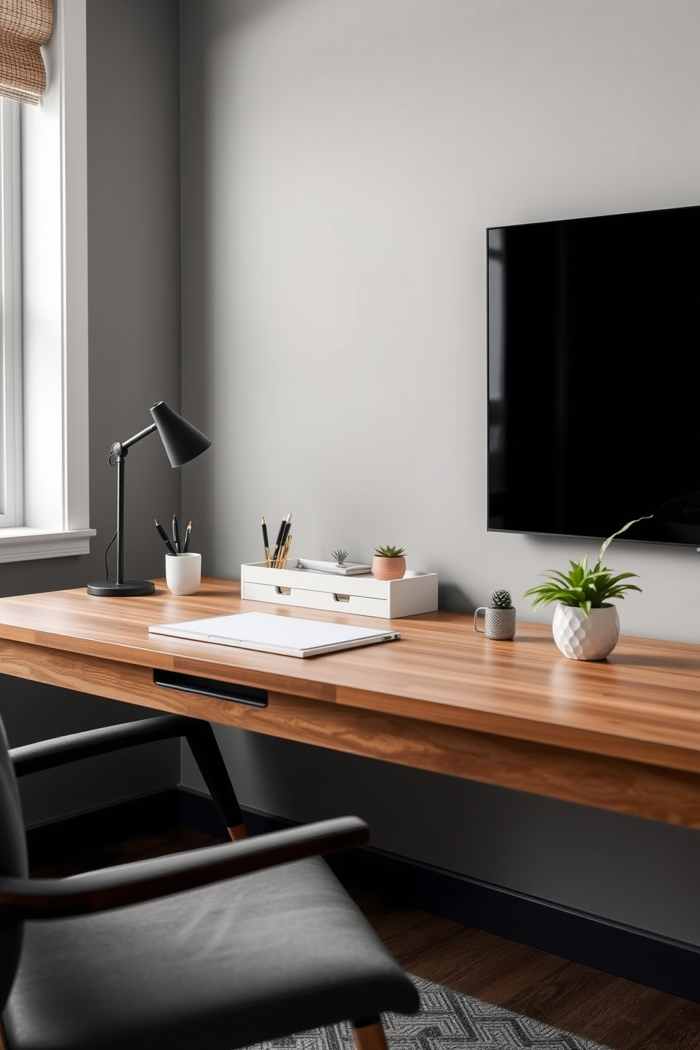 A sleek wooden desk is adorned with elegant desk accessories including a stylish pen holder, a minimalist desk organizer, and a decorative plant. The accessories are arranged neatly to enhance productivity while adding a touch of sophistication to the modern study room. The walls are painted in a soft gray hue, complemented by a large window that allows natural light to flood the space. A cozy chair sits beside the desk, creating an inviting atmosphere perfect for focused work or study sessions.