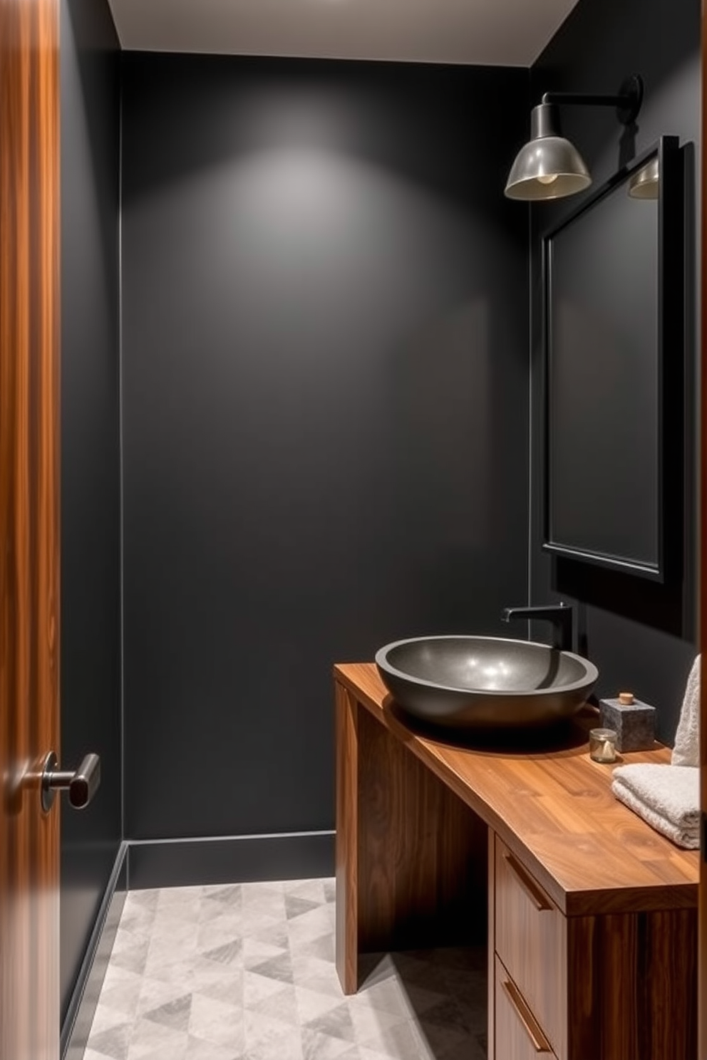 A moody powder room featuring rich dark walls paired with warm wood tones. The space includes a sleek wooden vanity with a deep sink and a stylish mirror framed in dark metal.