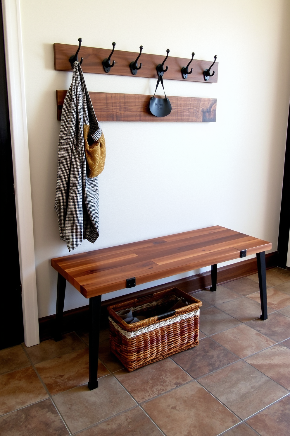 A functional mudroom featuring a stylish bench with an integrated laundry basket. The bench is upholstered in a durable fabric, and the laundry basket is discreetly tucked underneath, maximizing space and convenience.