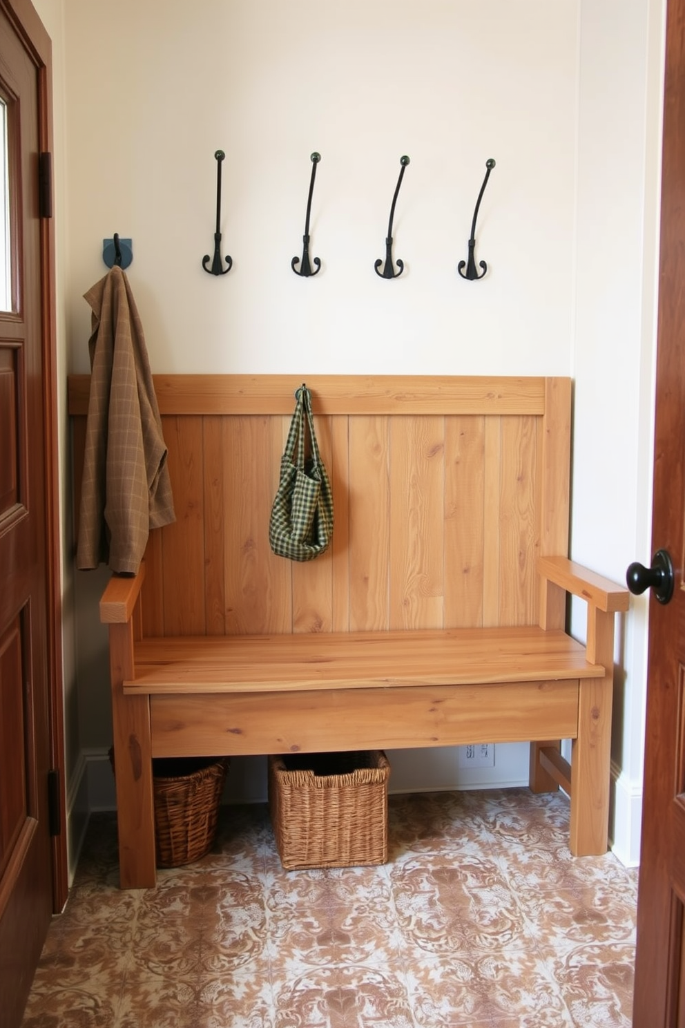 A modern minimalist bench with sleek metal accents is positioned against a wall in the mudroom. The bench features a clean design with a smooth surface and integrated storage underneath, perfect for shoes and outdoor gear.