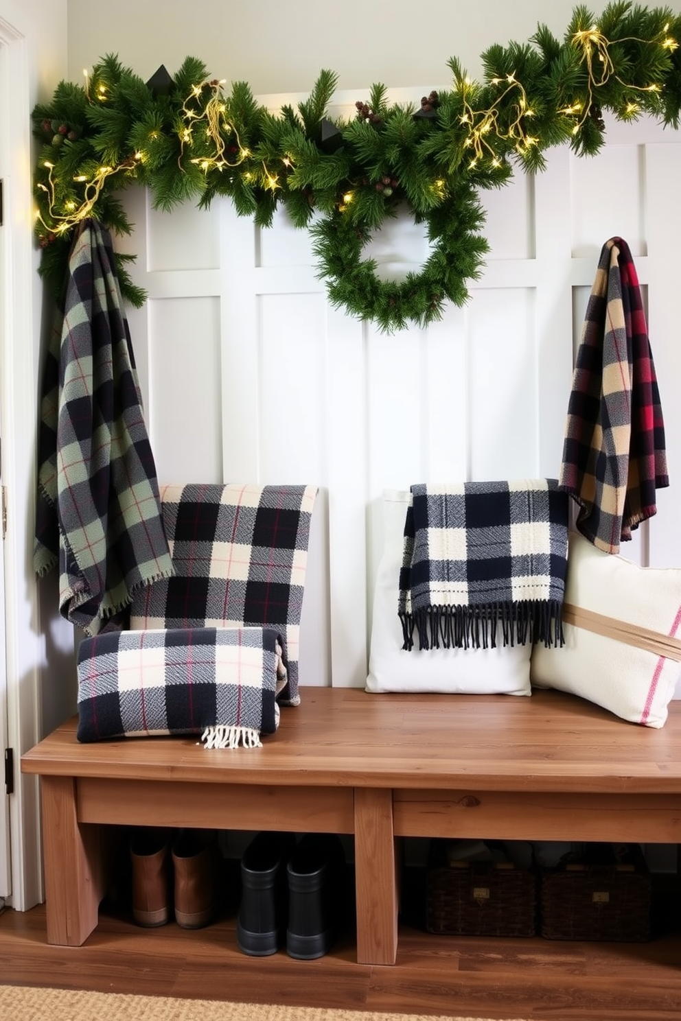 Cozy plaid throw blankets are draped over wooden benches in a welcoming mudroom. The space is adorned with festive Christmas decorations, including garlands and twinkling lights, creating a warm and inviting atmosphere.