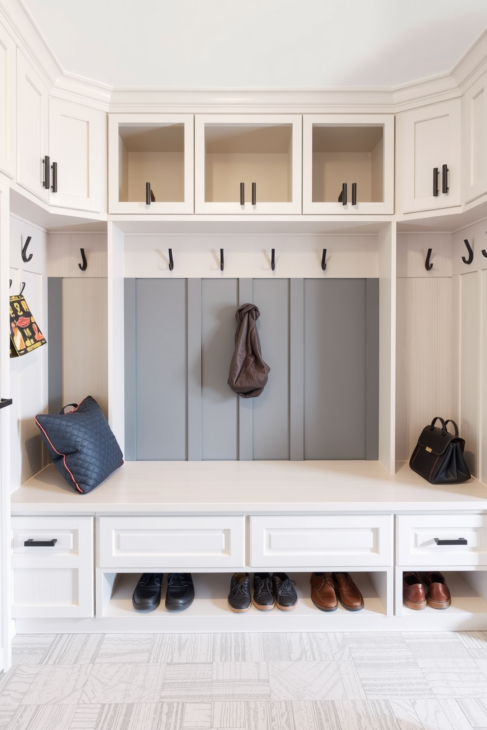 A stylish mudroom features a built-in bench with storage cubbies above for shoes and bags. Accent lighting is installed above the bench to highlight the space, creating a warm and inviting atmosphere. The walls are painted in a soft gray tone, complemented by a patterned tile floor that adds visual interest. Hooks for coats are mounted on the wall, and a decorative rug lies beneath the bench, enhancing the overall design.