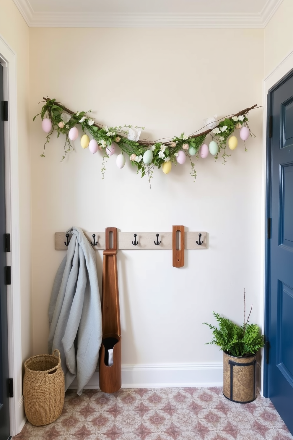 A charming mudroom featuring a seasonal garland adorned with pastel-colored eggs and spring flowers hanging gracefully above a set of rustic wooden hooks. The walls are painted in a soft cream hue, and the floor is covered with a durable, patterned tile that adds a touch of character to the space.