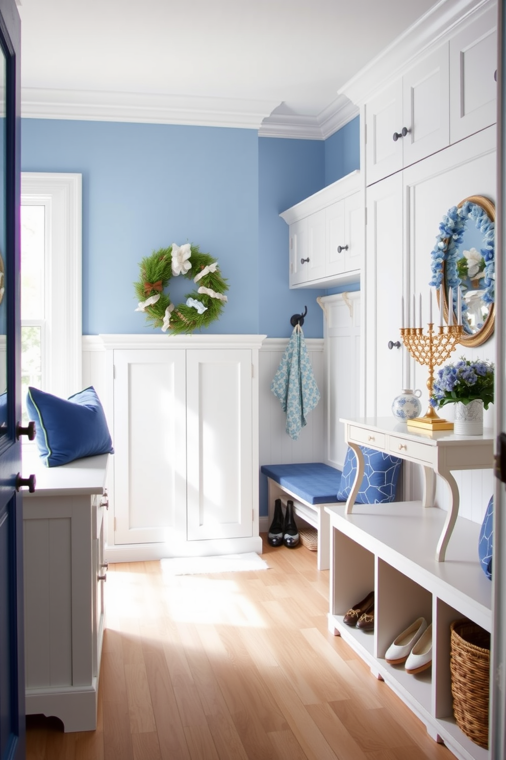 A bright and inviting mudroom features a blue and white color scheme that creates a fresh atmosphere. The walls are painted in a soft blue, while the cabinetry is a crisp white, providing ample storage for shoes and coats. Decorative elements celebrating Hanukkah are elegantly displayed, including a menorah on a console table and blue and white themed ornaments. A cozy bench with blue cushions invites guests to sit while they remove their shoes, enhancing the welcoming feel of the space.