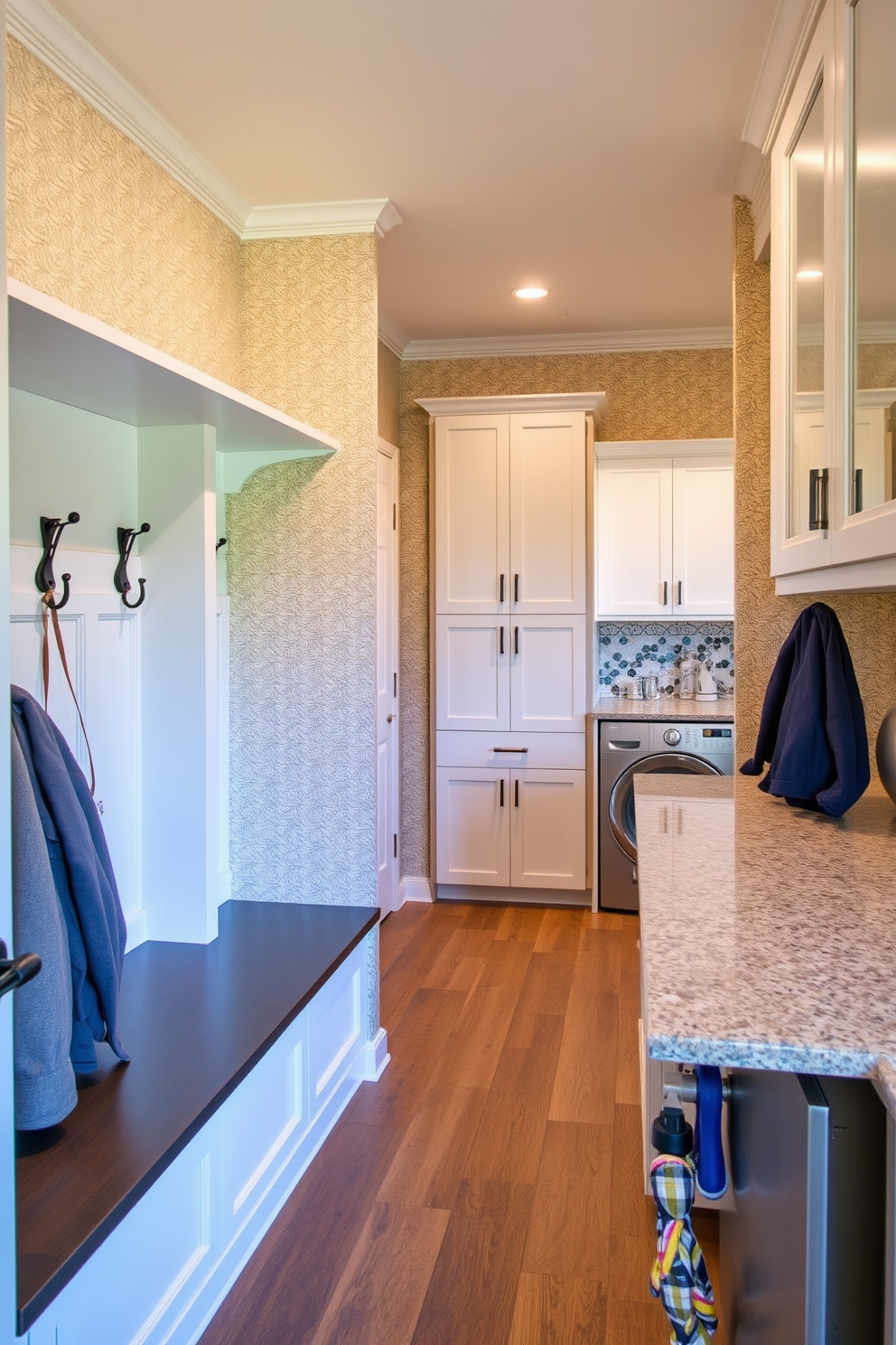 A stylish mudroom featuring accent mirrors strategically placed to enhance the sense of space. The design includes a built-in bench with storage underneath and a wall of hooks for coats and bags. The laundry room is designed with a functional layout that maximizes efficiency and style. It features sleek cabinetry, a countertop for folding clothes, and a large sink for handwashing delicate items.