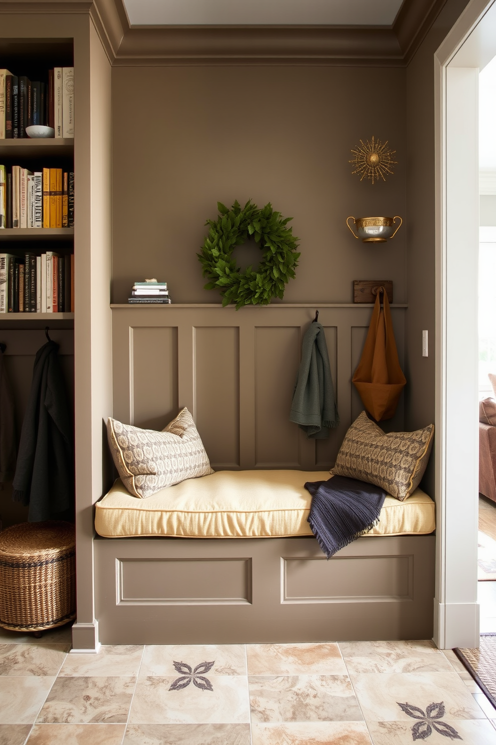 Cozy built-in bench with storage in a mudroom near the family room. The bench is upholstered in a soft fabric with plush cushions, and the surrounding walls are adorned with shiplap for a warm, inviting feel.