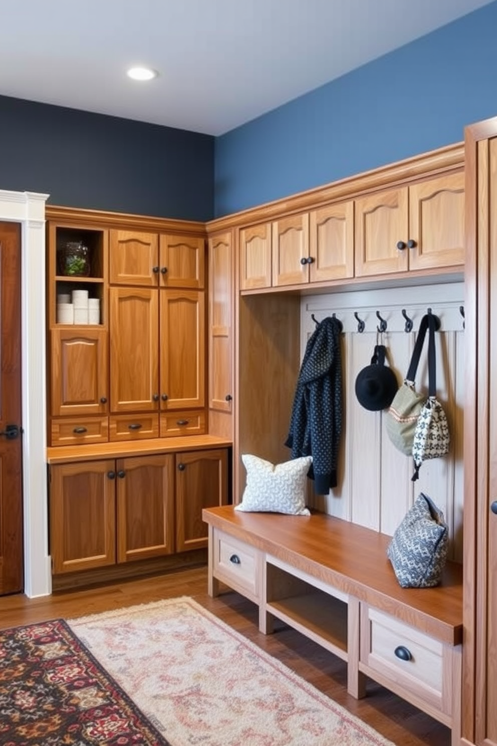 A functional mudroom designed for high traffic areas features durable materials such as ceramic tile flooring and a sturdy wooden bench. The walls are adorned with hooks for coats and bags, while built-in cabinets provide ample storage for shoes and outdoor gear. Adjacent to the family room, the mudroom seamlessly transitions with a color palette that complements the living space. Natural light floods in through a window, enhancing the inviting atmosphere of this practical yet stylish area.