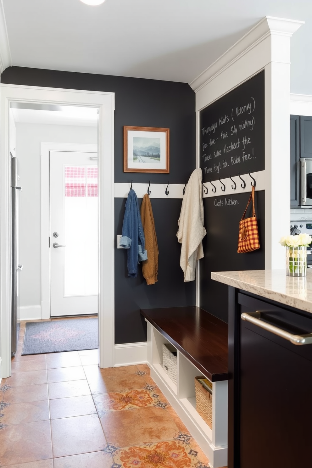 A functional mudroom adjacent to the kitchen features a chalkboard wall for notes and reminders. The space includes built-in benches with storage underneath, hooks for coats, and a stylish tile floor that complements the kitchen's design.