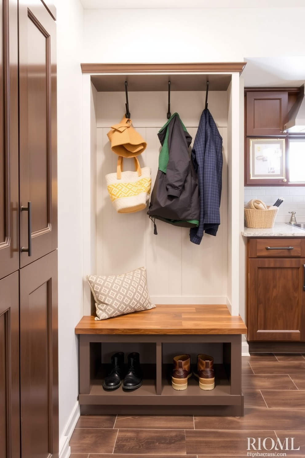 A functional mudroom near the kitchen features multi-use furniture that maximizes space and enhances organization. A built-in bench with storage underneath provides seating and a place to store shoes, while wall-mounted hooks keep coats and bags easily accessible.