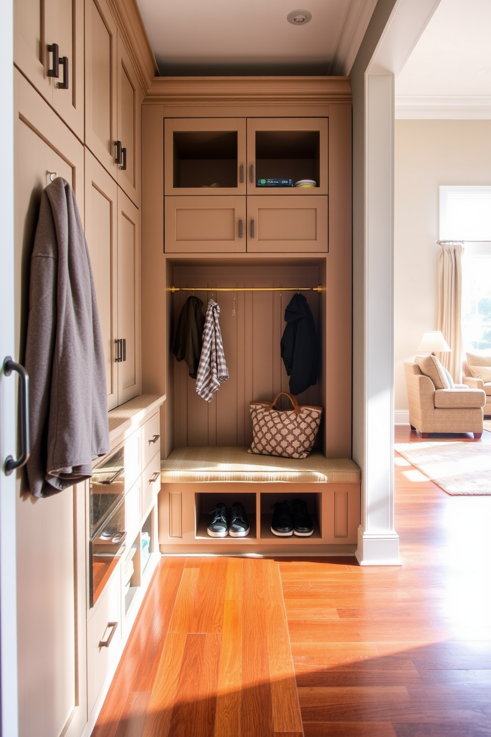 A stylish mudroom adjacent to the living room features hidden laundry hampers seamlessly integrated into custom cabinetry. The space is adorned with a combination of natural wood finishes and soft gray walls, creating a welcoming atmosphere.