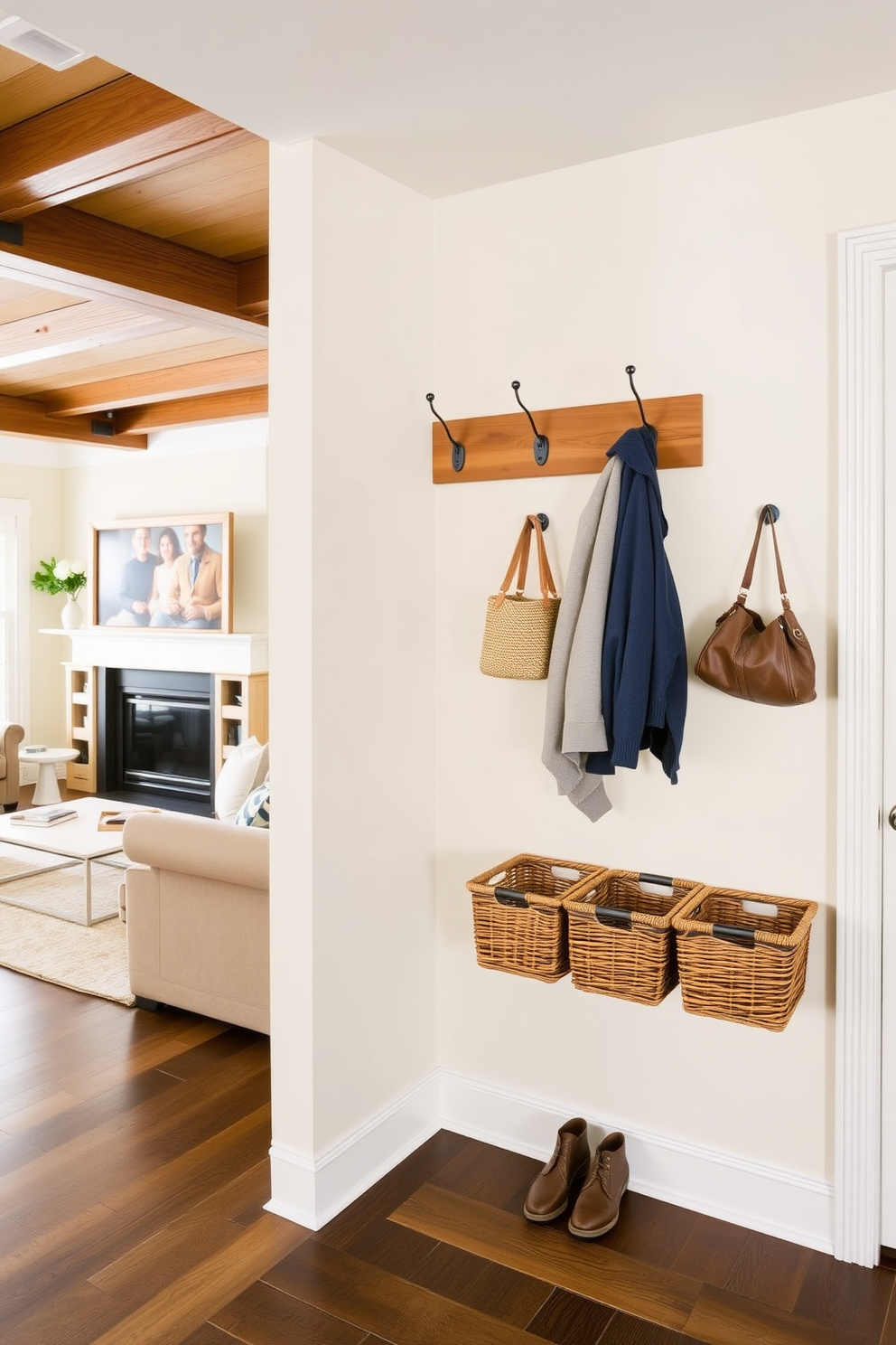 A functional mudroom design adjacent to the living room features wall-mounted organizers for small items. The organizers are crafted from natural wood and include hooks for coats and baskets for shoes, creating an inviting and practical entryway.