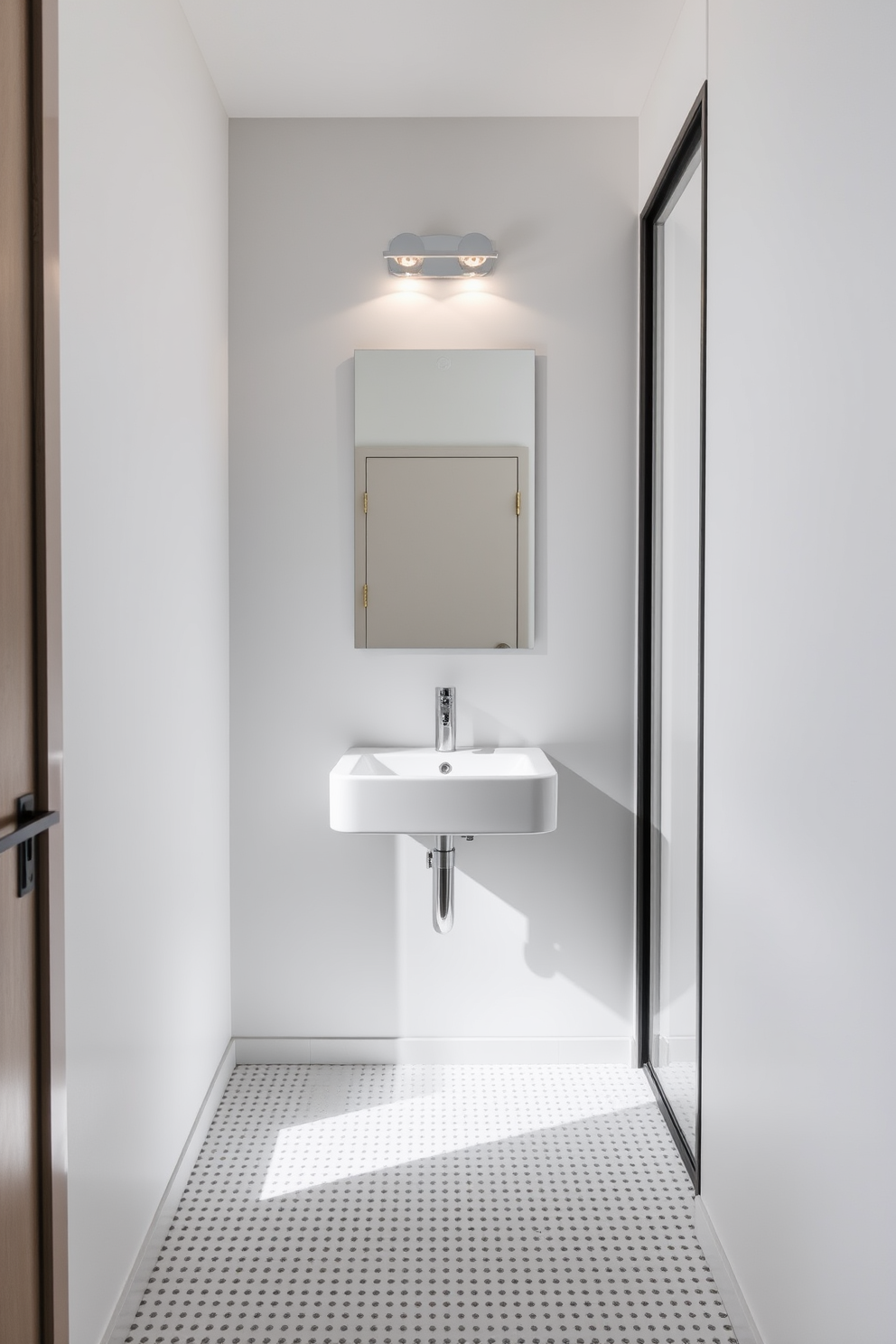 A narrow bathroom design featuring a corner sink to maximize space efficiency. The walls are adorned with light gray tiles, and a sleek, modern mirror is mounted above the sink. To the right, a compact shelving unit holds neatly arranged toiletries and decorative items. Soft, ambient lighting illuminates the space, creating a warm and inviting atmosphere.