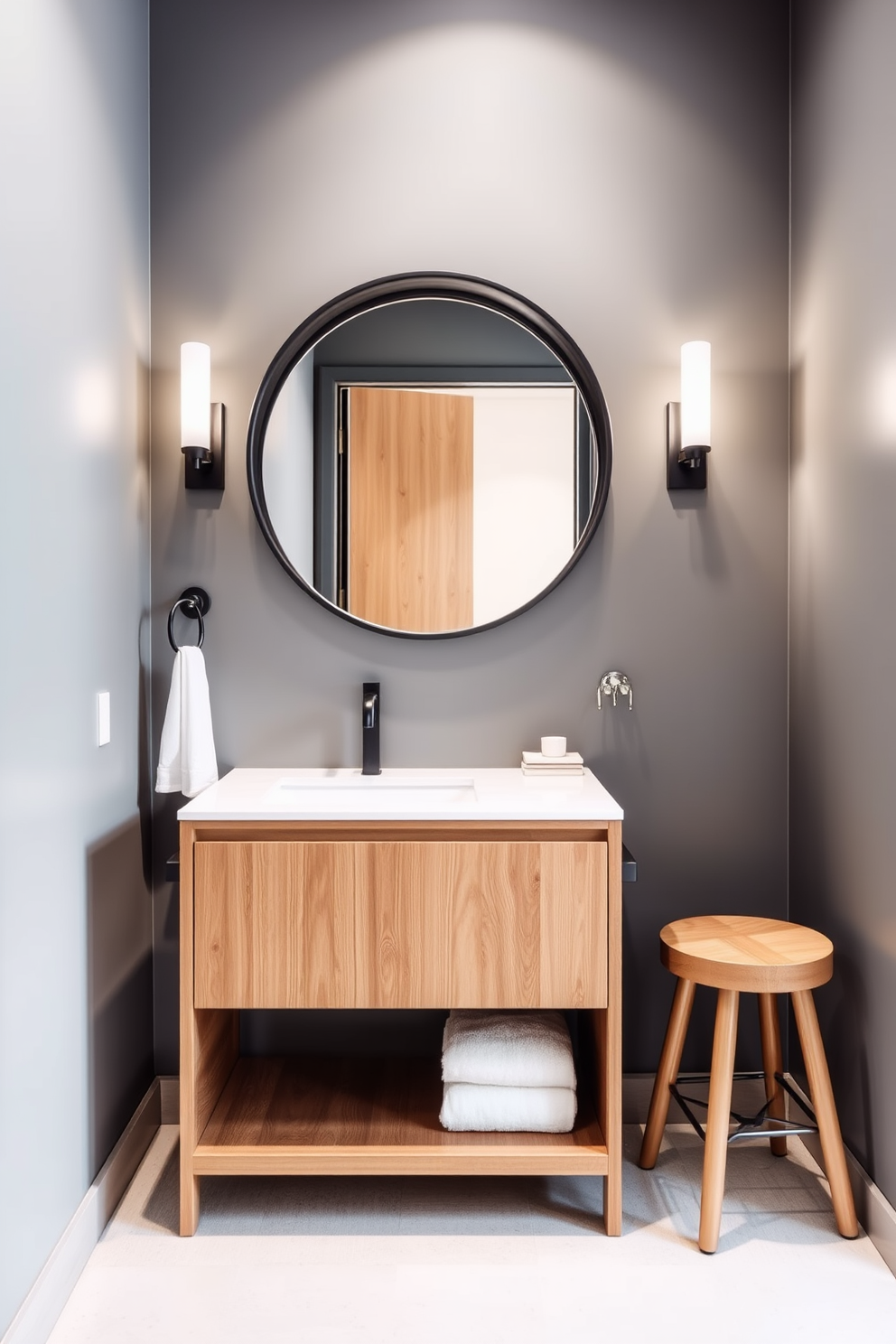 A narrow bathroom featuring built-in cabinetry that provides seamless storage solutions. The cabinetry is finished in a soft white hue, blending effortlessly with the pale gray walls and enhancing the space's brightness. The design includes a sleek, wall-mounted sink with a minimalist faucet, maximizing floor space. A large, frameless mirror reflects light, creating an illusion of depth and openness in the narrow layout.