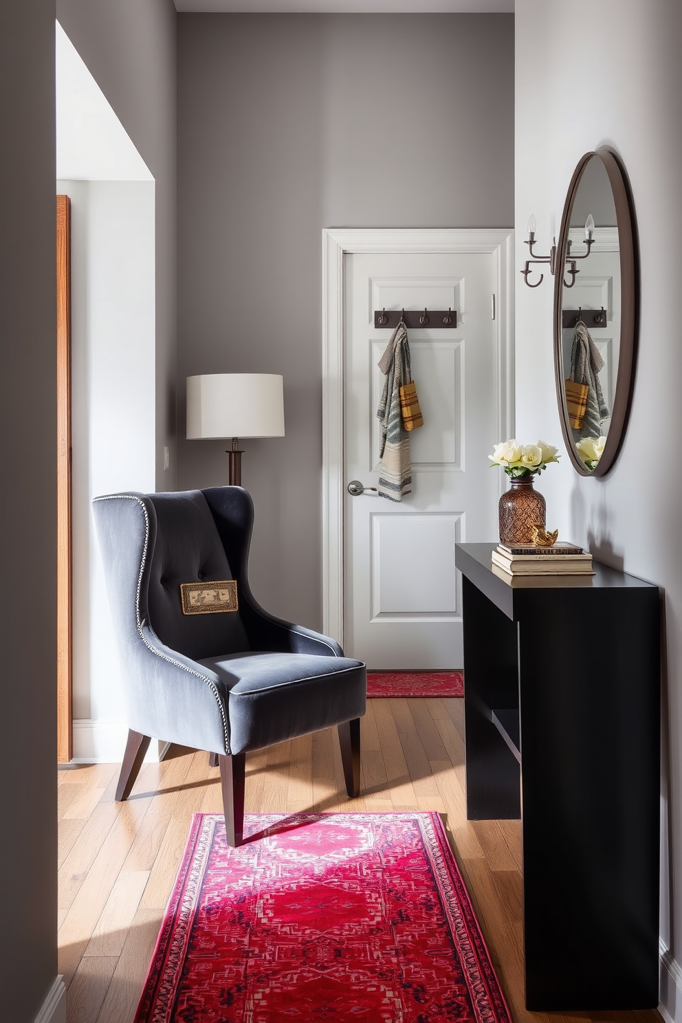 A stylish accent chair in a rich velvet fabric is positioned in the corner, featuring elegant tapered legs and a high back for added support. The chair is complemented by a small side table adorned with a decorative lamp and a stack of books. The narrow entryway is designed with a sleek console table against the wall, topped with a mirror that enhances the sense of space. A vibrant runner rug adds warmth and color, while wall hooks provide practical storage for coats and bags.