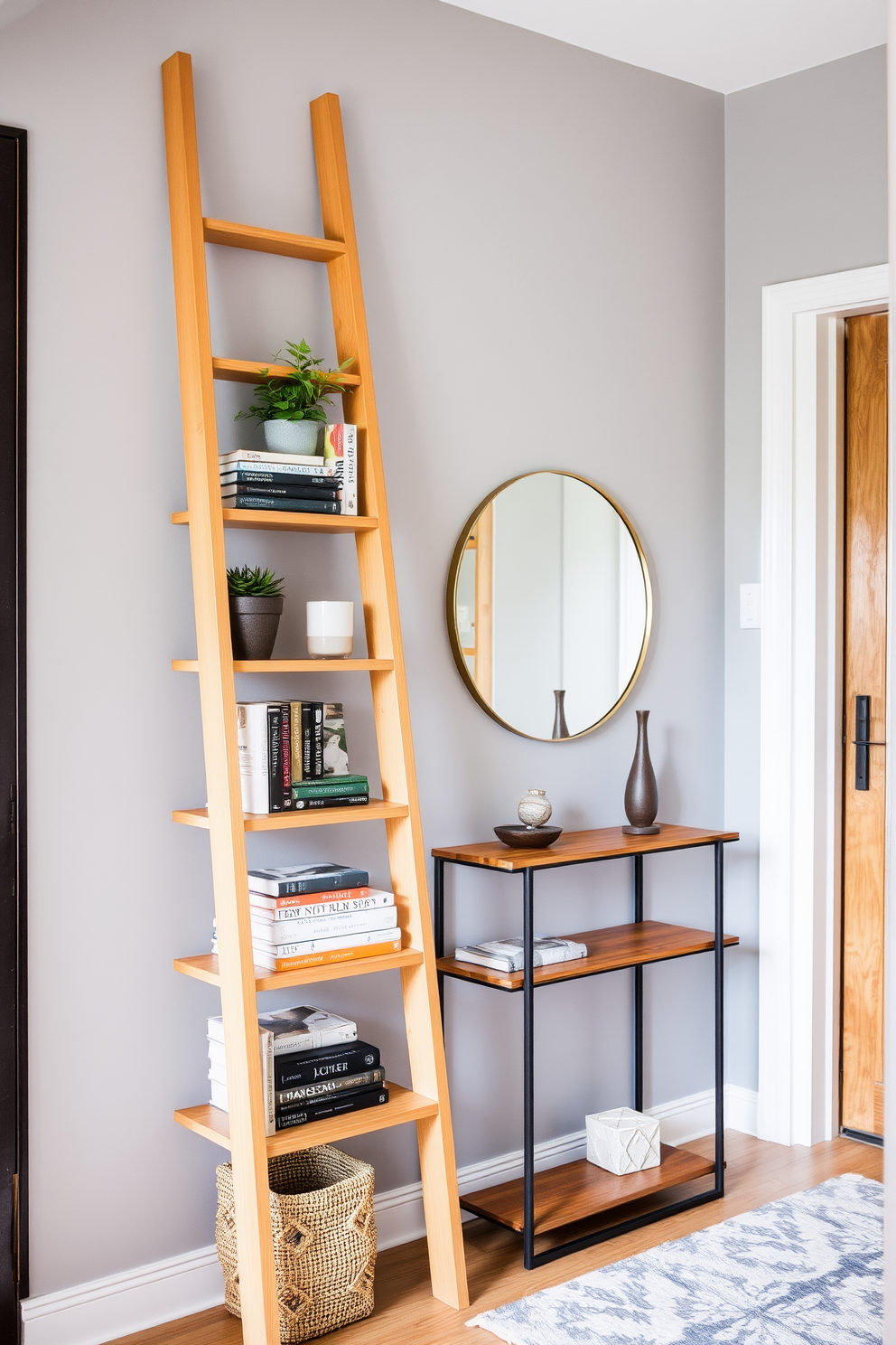 A stylish ladder shelf made of natural wood leans against a soft gray wall. It holds a curated selection of books and decorative items, including a potted plant and a small sculpture. The narrow entryway features a sleek console table with a warm wood finish. Above it, a round mirror reflects light, while a cozy rug adds texture and warmth to the space.