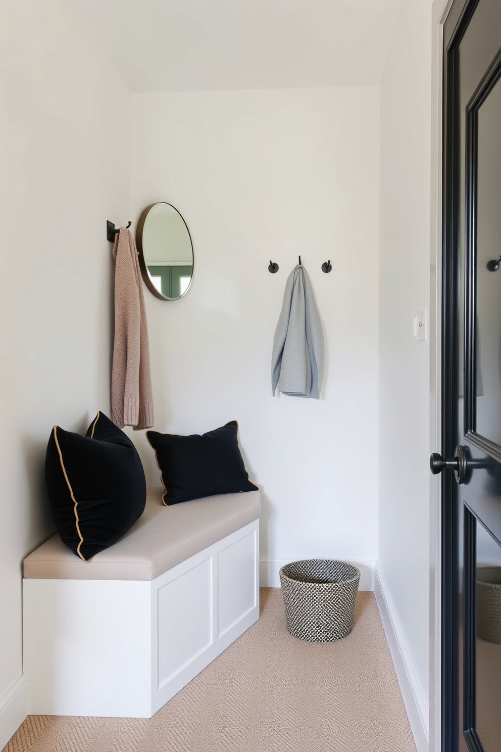 A narrow entryway features a sleek bench that serves both seating and storage purposes. The bench is upholstered in a soft fabric and is paired with a minimalist coat rack on the wall. The walls are painted in a light neutral color to enhance the sense of space. A small, round mirror hangs above the bench, reflecting natural light and creating an inviting atmosphere.