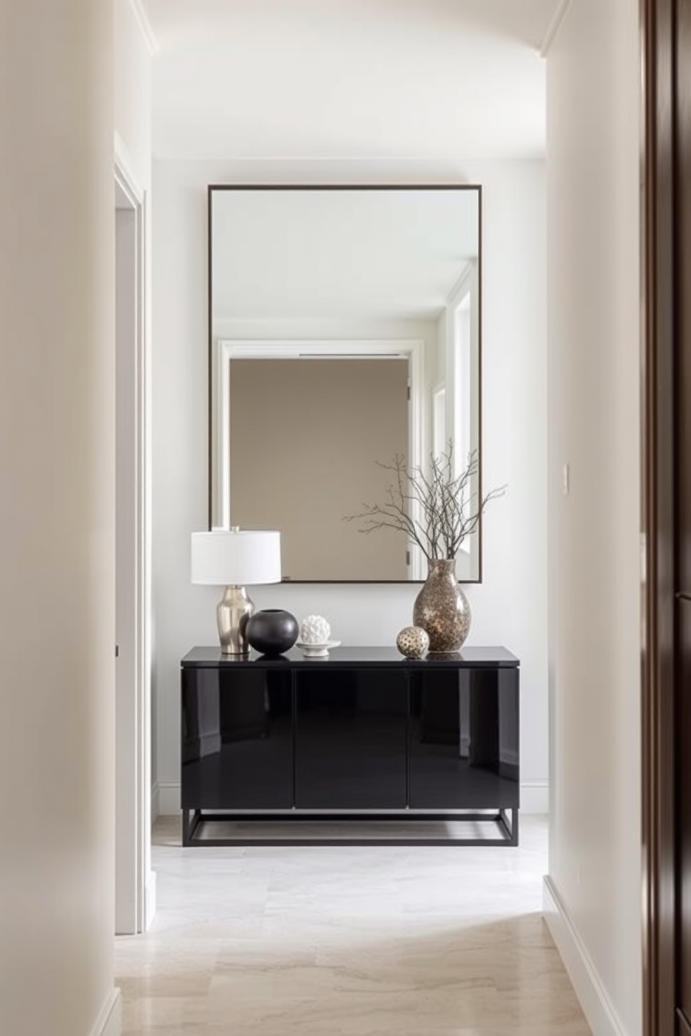 A narrow console table with elegant drawers sits against the wall in the foyer. The console features a rich wood finish and intricate detailing, providing both style and functionality. Above the console, a large round mirror reflects natural light, enhancing the space's openness. Flanking the console are decorative potted plants that add a touch of greenery and warmth to the narrow entryway.