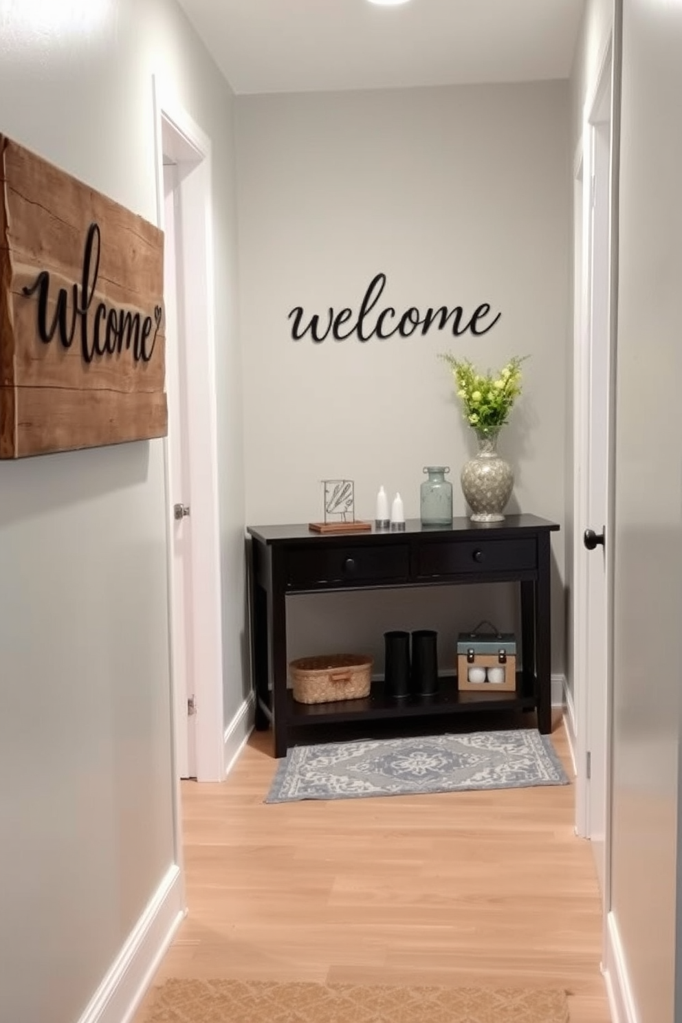 A charming narrow foyer features a personalized welcome sign made of rustic wood, elegantly displayed on the wall. The space is adorned with soft lighting and a small console table, topped with decorative items that reflect the homeowner's style.