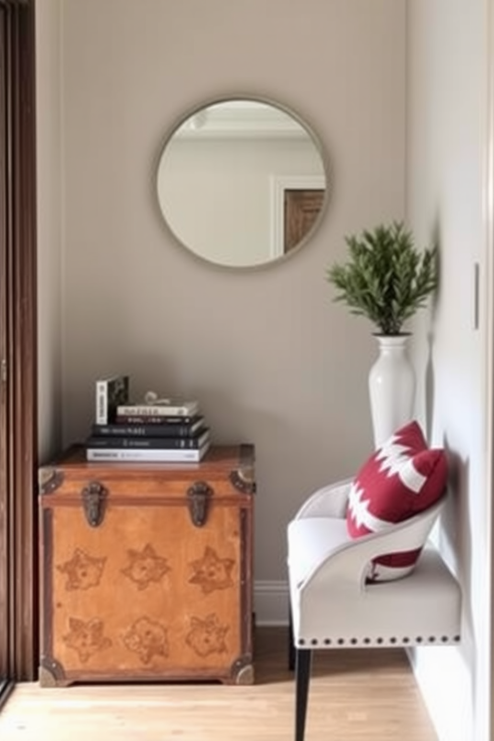 A narrow foyer featuring a sleek console table against the wall, topped with a decorative lamp and a small potted plant. To the side, a stylish coat rack with an elegant design holds a few hanging coats and accessories, enhancing the space's functionality and aesthetics.