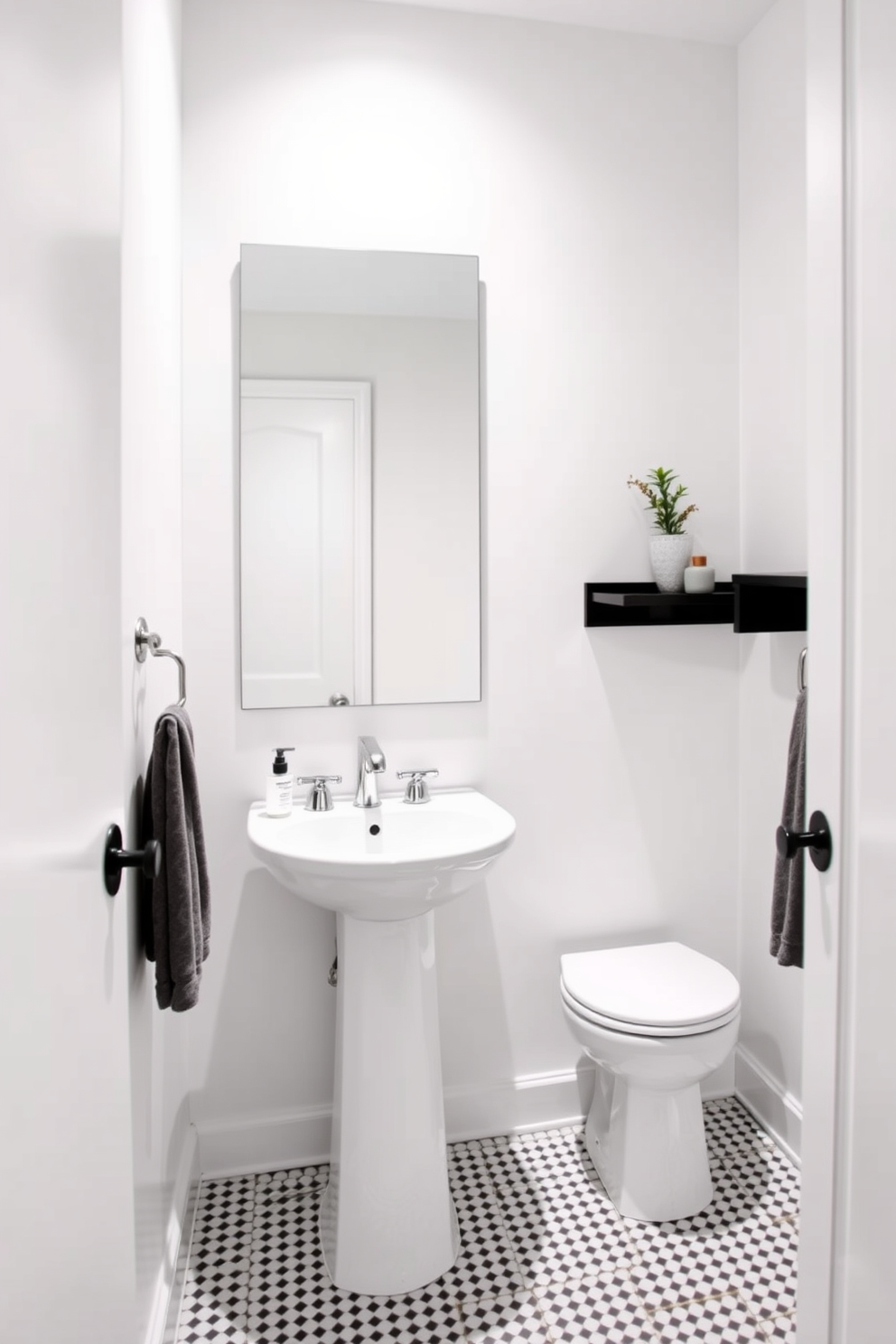 A narrow powder room features a sleek pedestal sink that emphasizes minimalism and space-saving design. The walls are adorned with a light, airy paint color, and a large mirror above the sink reflects the room's brightness. To enhance the minimalist aesthetic, opt for simple, elegant fixtures and accessories that complement the clean lines of the sink. A small potted plant or a single decorative item can be placed on a nearby shelf to add a touch of warmth without cluttering the space.