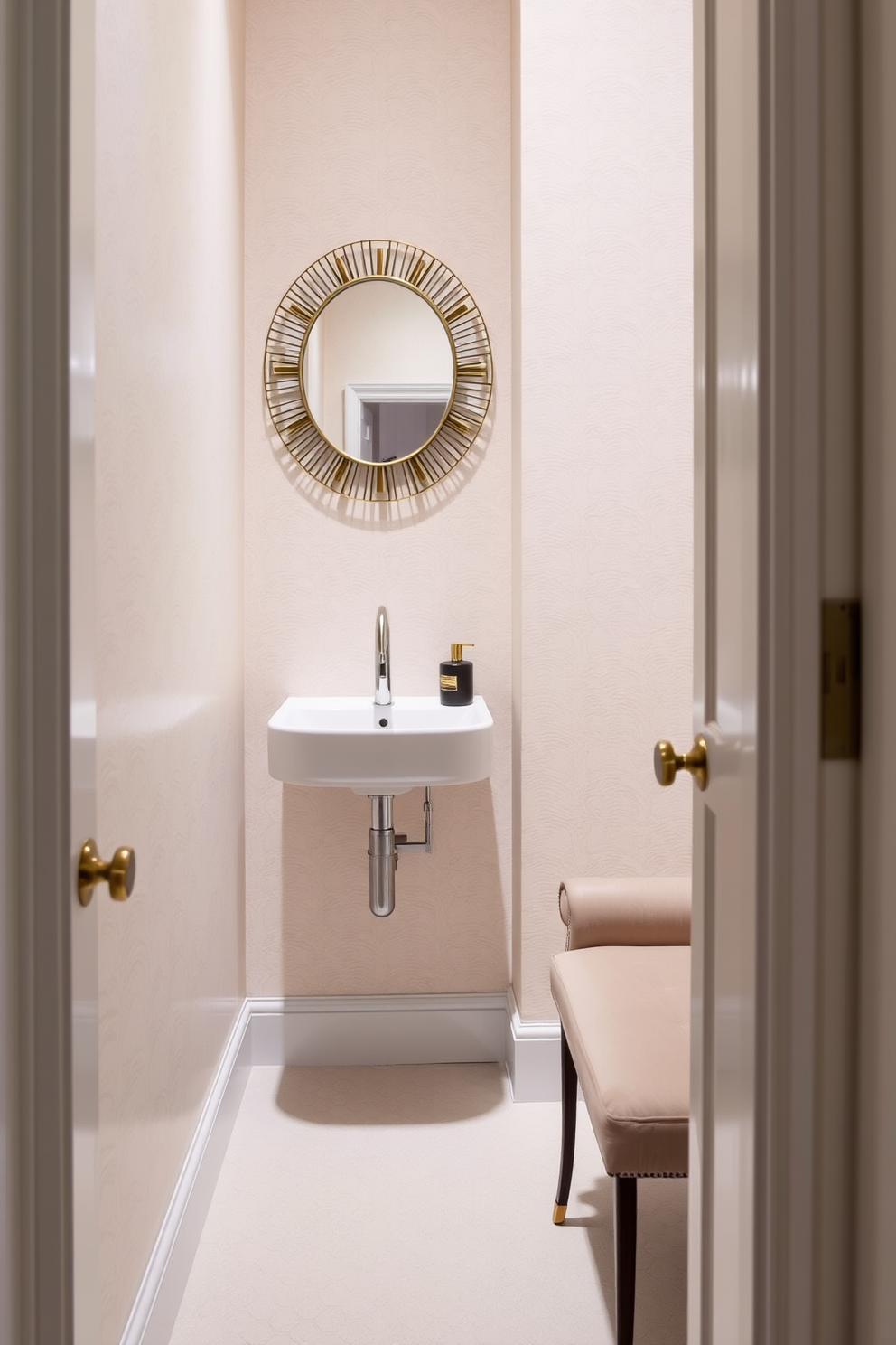 A narrow powder room features a sleek wall-mounted sink with a stylish faucet. To the side, a small upholstered bench adds a touch of comfort and elegance, perfect for a compact space. The walls are adorned with a soft pastel wallpaper, while the floor is laid with chic hexagonal tiles. A round mirror with a decorative frame hangs above the sink, enhancing the room's sense of depth and style.