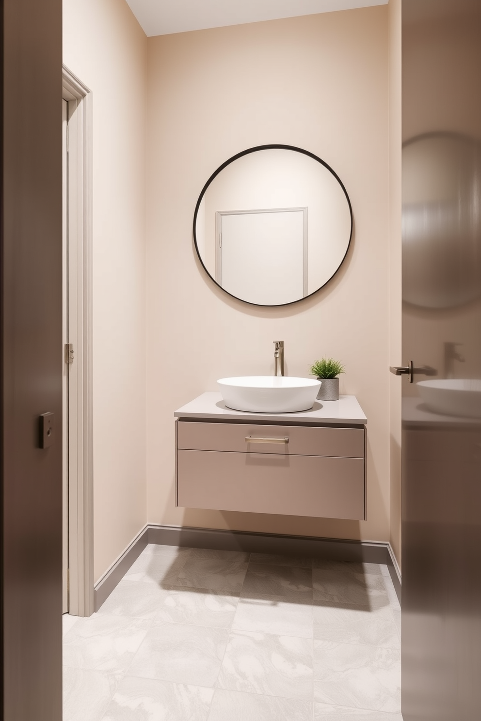 A narrow powder room featuring minimalist decor emphasizes a clean and uncluttered aesthetic. The walls are painted in a soft white hue, and a sleek floating vanity with a single sink is mounted against one wall. A large round mirror hangs above the vanity, reflecting natural light from a small window. Simple accessories like a small potted plant and a hand towel in muted tones complete the serene atmosphere.