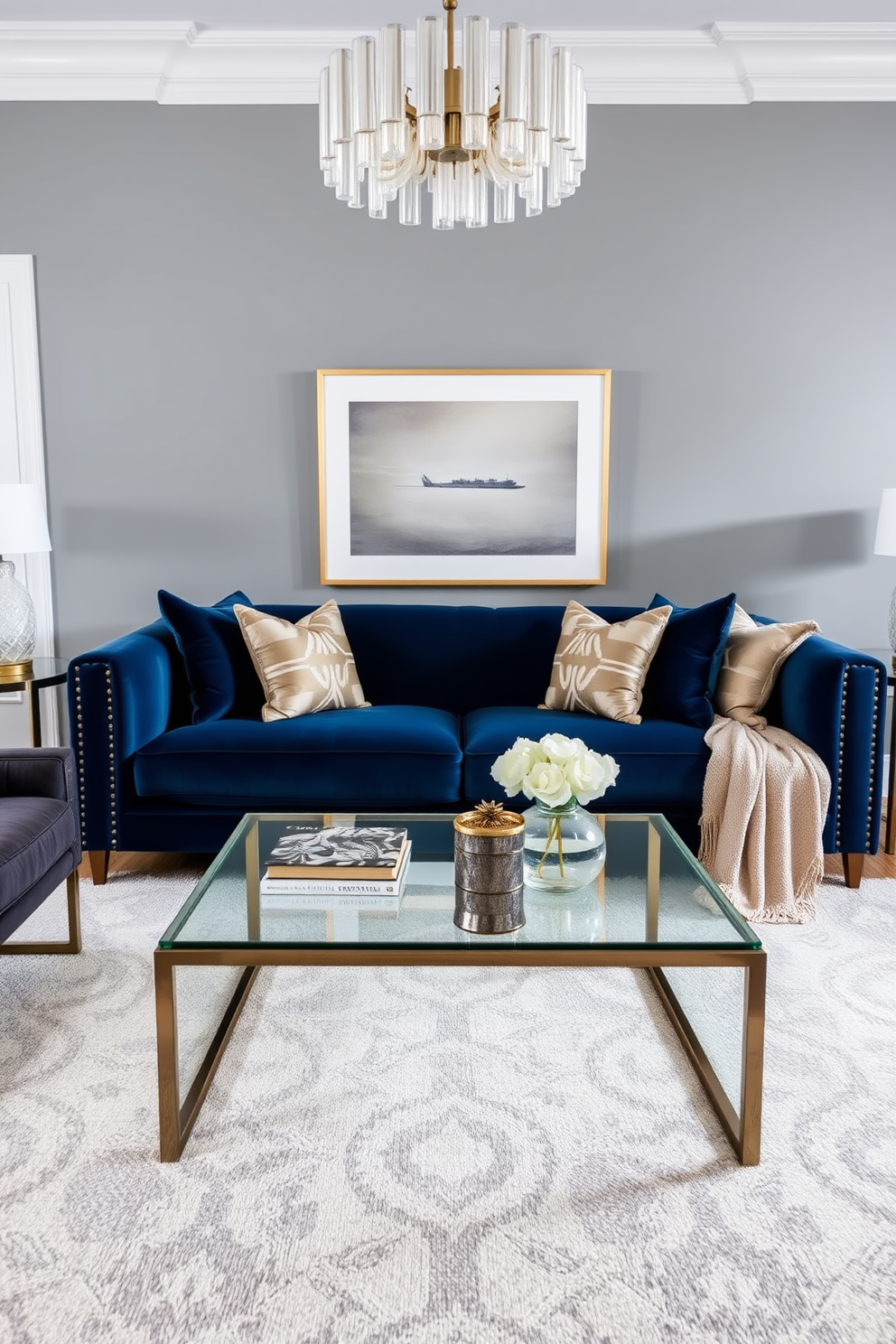 A stylish living room featuring a navy blue couch adorned with metallic decor accents. The couch is complemented by a sleek coffee table with a glass top and metallic legs, creating a modern aesthetic. Surrounding the couch, plush throw pillows in varying textures add comfort and visual interest. The walls are painted in a soft gray, enhancing the richness of the navy while a statement light fixture adds a touch of elegance to the space.