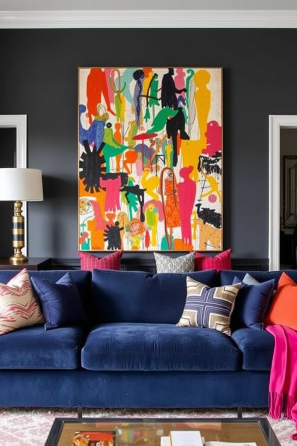 A stylish living room featuring a navy blue couch adorned with vibrant throw pillows in various colors. Behind the couch, a large piece of colorful abstract art serves as a striking focal point, enhancing the room's modern aesthetic.