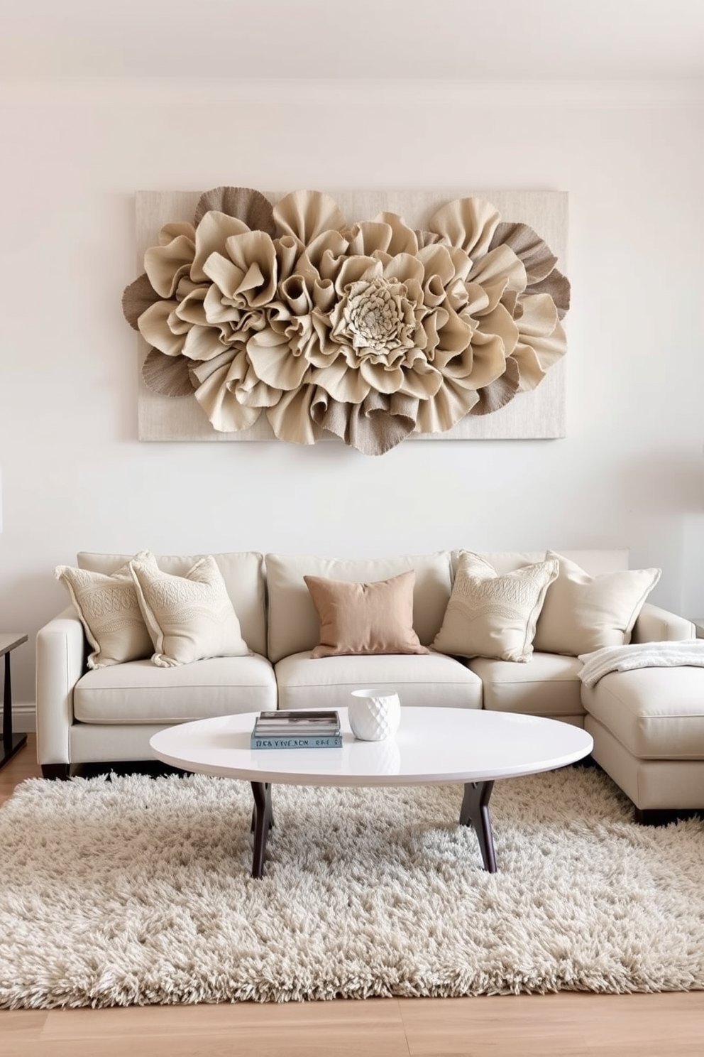 Textured wall art creates a focal point in the living room with layers of fabric and mixed materials. The artwork is complemented by a soft color palette featuring beige and light gray tones. The neutral living room design features a comfortable sectional sofa adorned with plush throw pillows. A sleek coffee table sits in the center, surrounded by a plush area rug that adds warmth to the space.