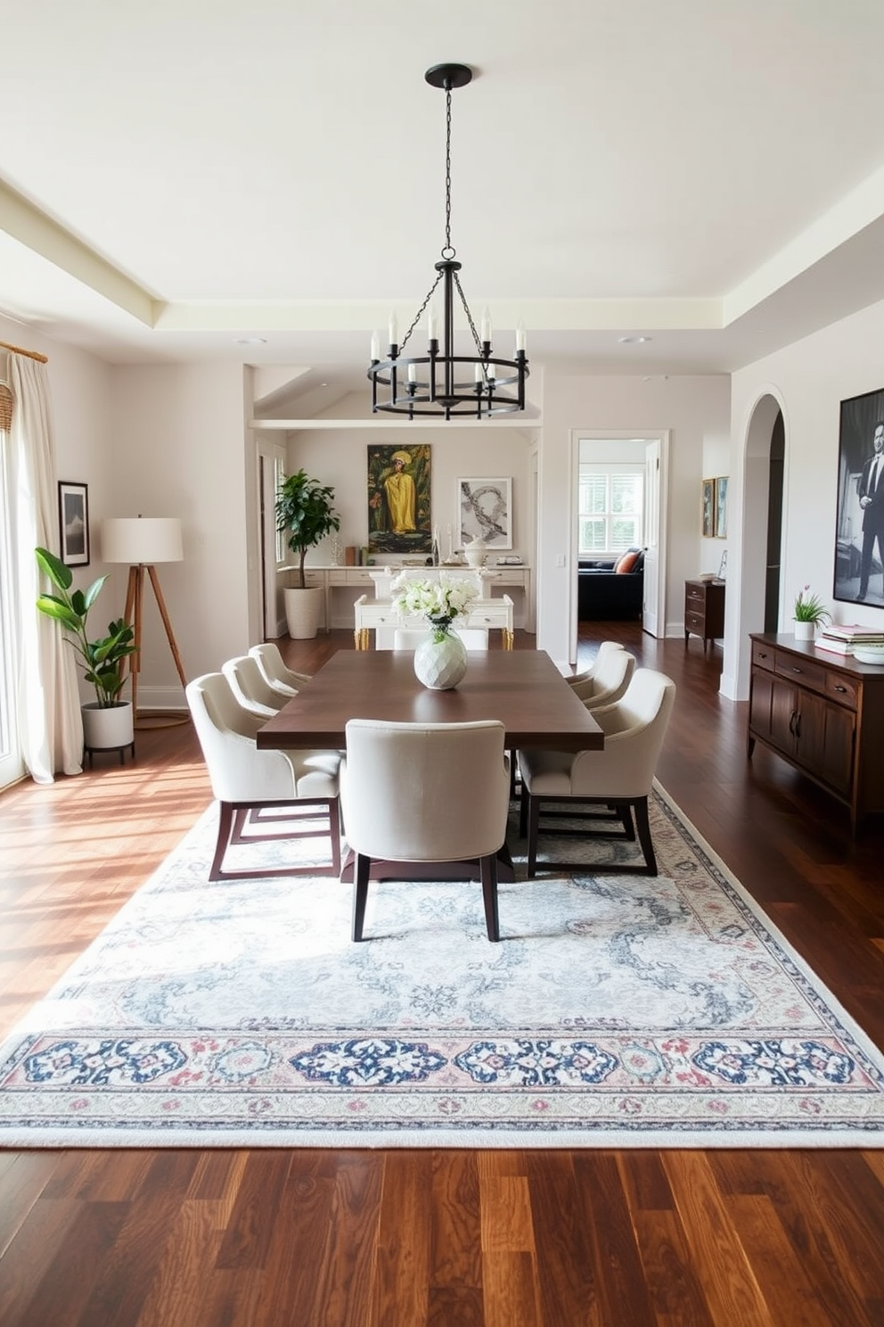 A spacious open floor plan dining room features a sleek console table against one wall, adorned with decorative items and a stylish lamp. The dining area is highlighted by a large wooden table surrounded by comfortable upholstered chairs, with a statement chandelier hanging above.