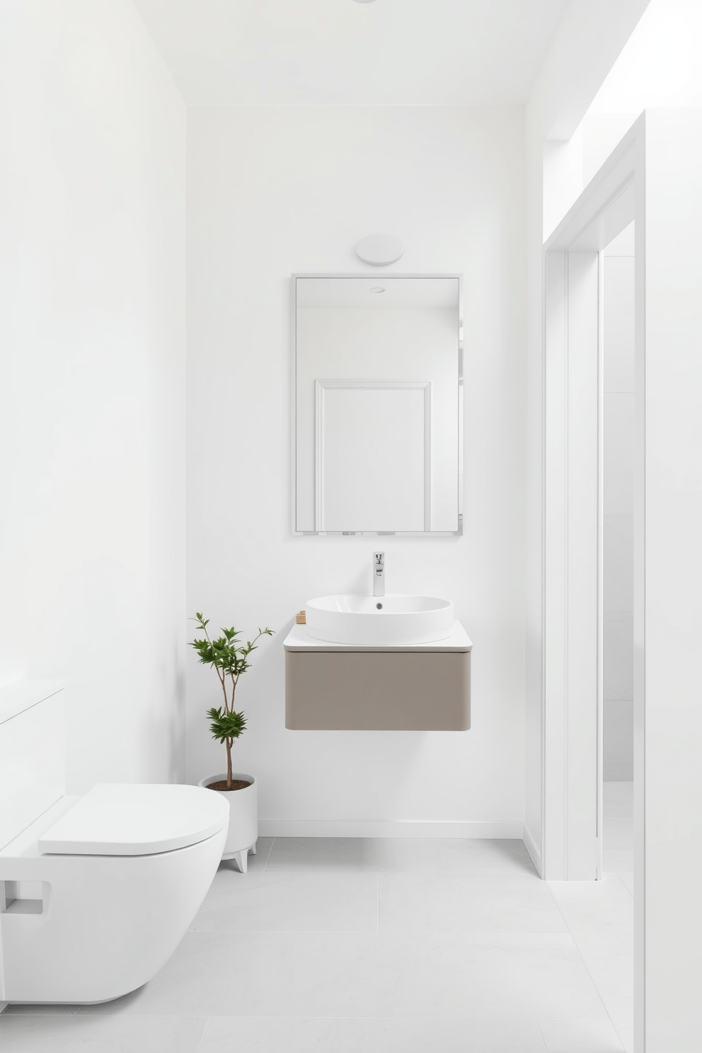 A minimalist powder room featuring clean lines and a serene atmosphere. The walls are painted in soft white, and a sleek floating vanity with a single sink is mounted against the wall. A large frameless mirror reflects the simplicity of the space, enhancing the feeling of openness. The floor is adorned with light gray tiles, and a small potted plant adds a touch of greenery to the decor.