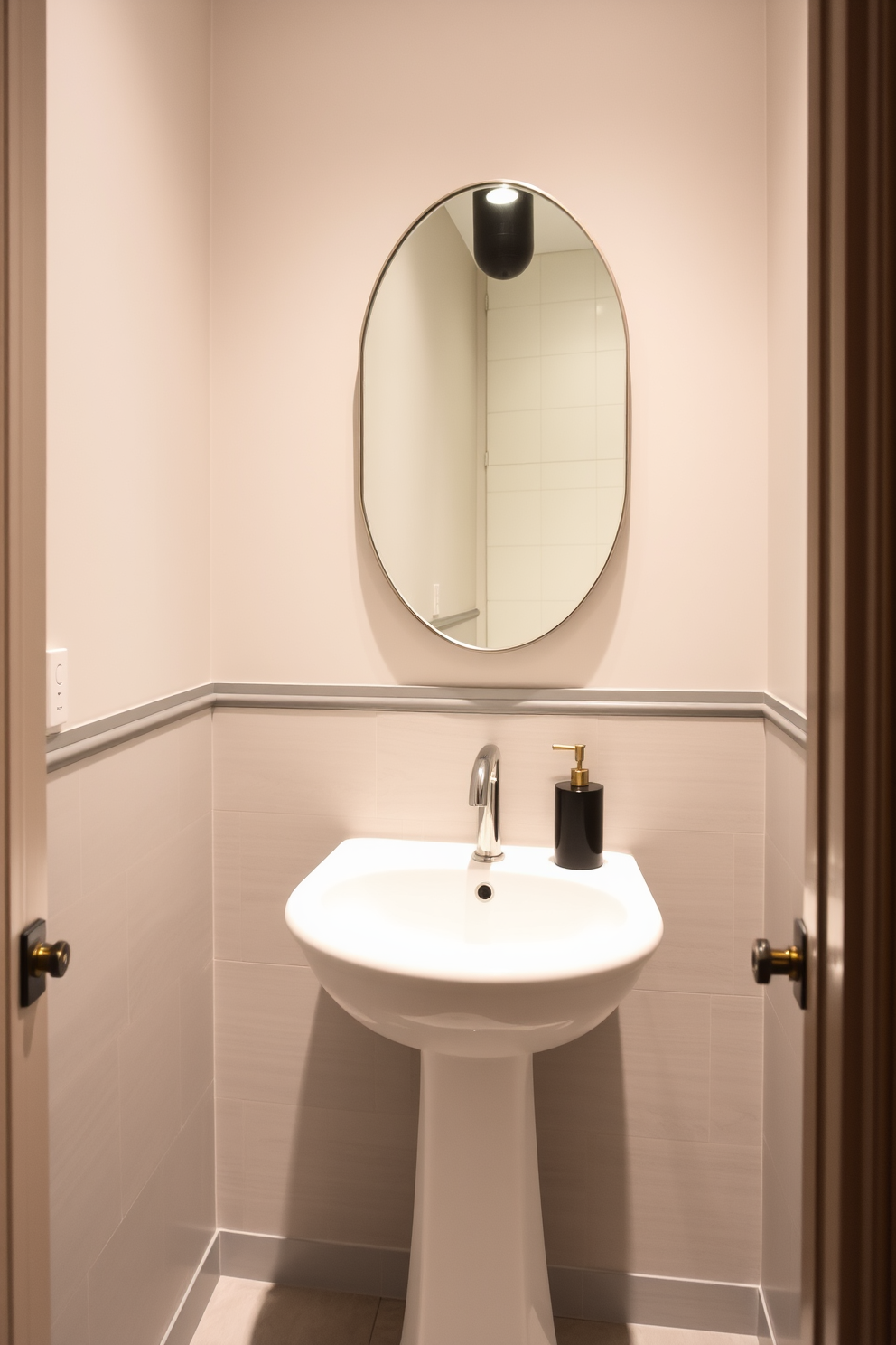 A chic powder room featuring matte finish tiles that exude understated sophistication. The walls are painted in a soft, neutral tone, and a sleek pedestal sink complements the elegant tile design.