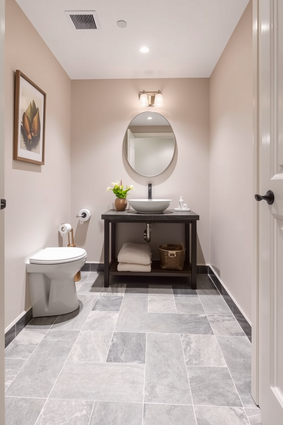 A stylish powder room featuring natural slate tiles that create an earthy and inviting atmosphere. The walls are adorned with soft neutral tones, complementing the rich texture of the slate flooring.