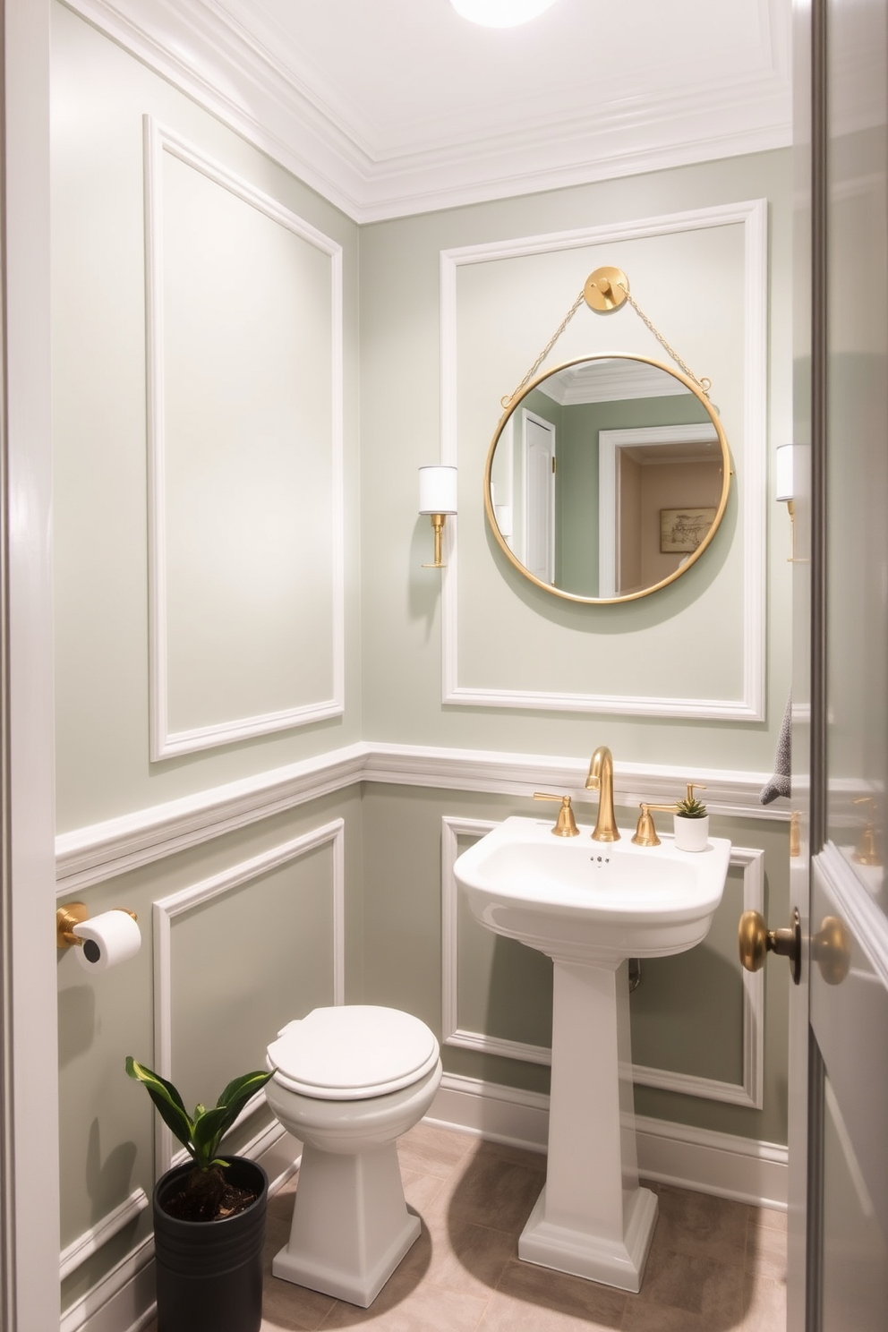 A serene powder room designed in soft sage green, creating a calming and inviting atmosphere. The walls are painted in a muted sage green, complemented by elegant white trim and fixtures. A stylish round mirror with a brass frame hangs above a sleek white pedestal sink. The floor is adorned with light gray tiles, and a small potted plant adds a touch of freshness to the space.